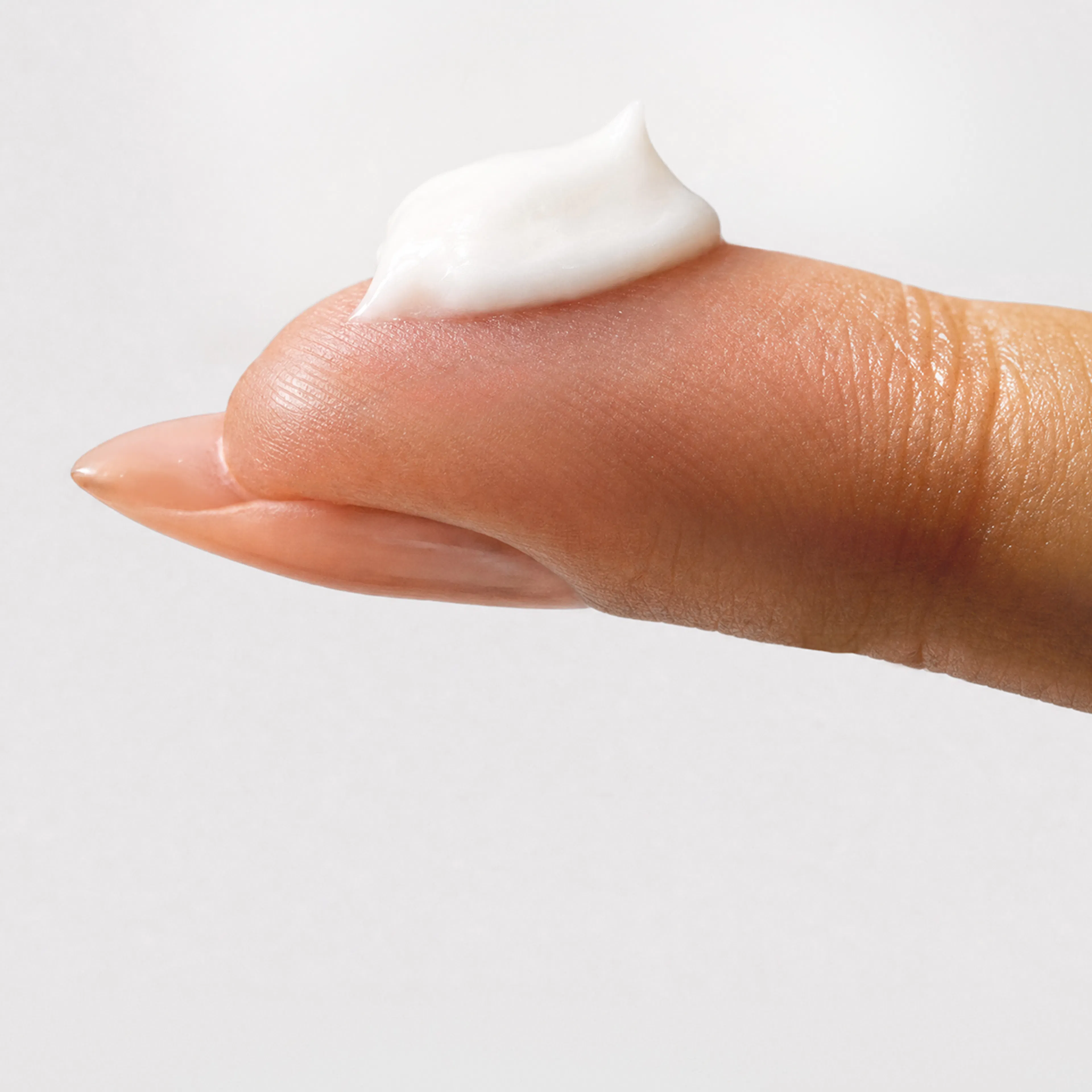 Estriol+ Face Cream on finger