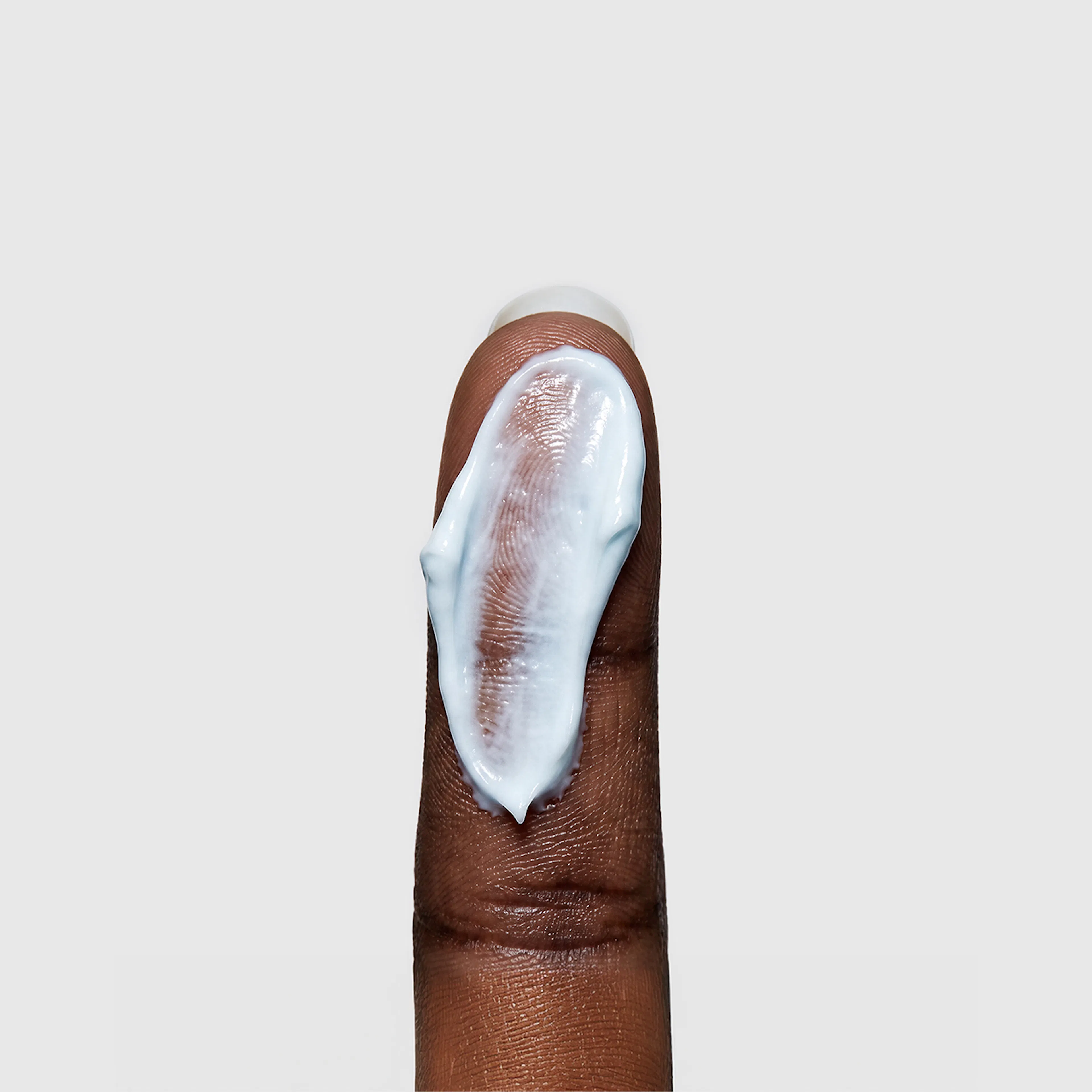 Copper Peptide Repair Cream on finger