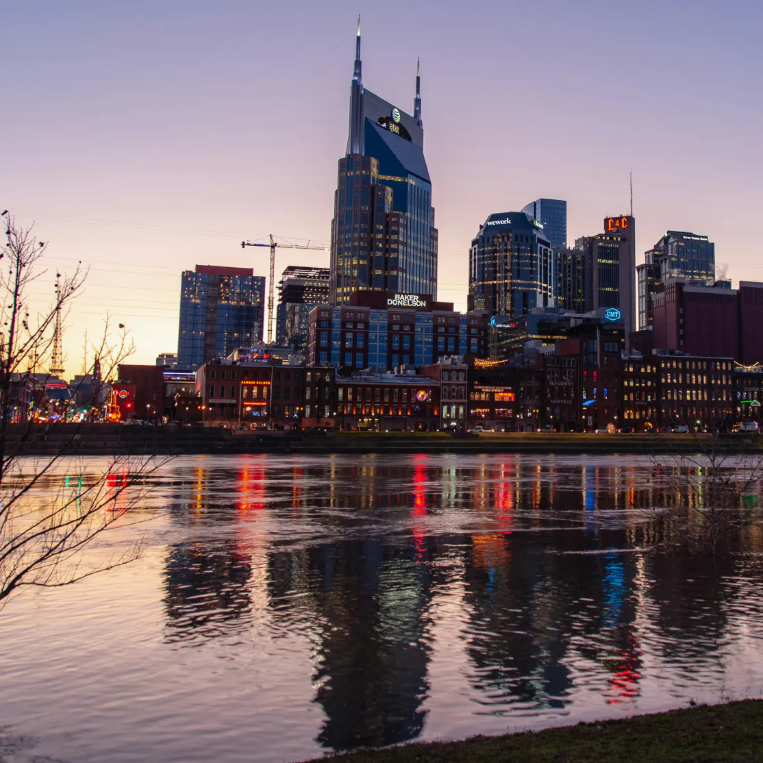 A photo of the Nashville skyline at dusk.