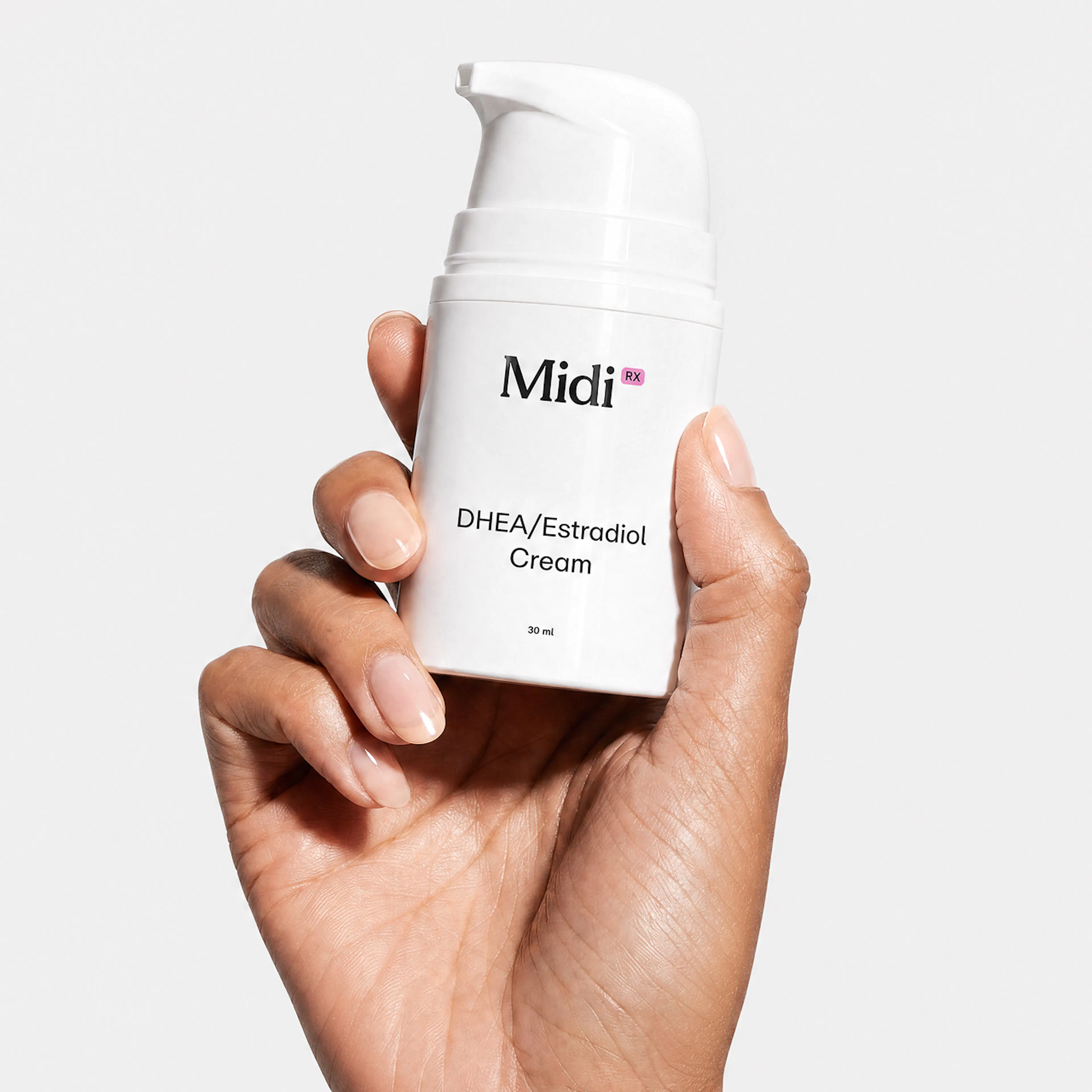 hand holding Estradiol Cream