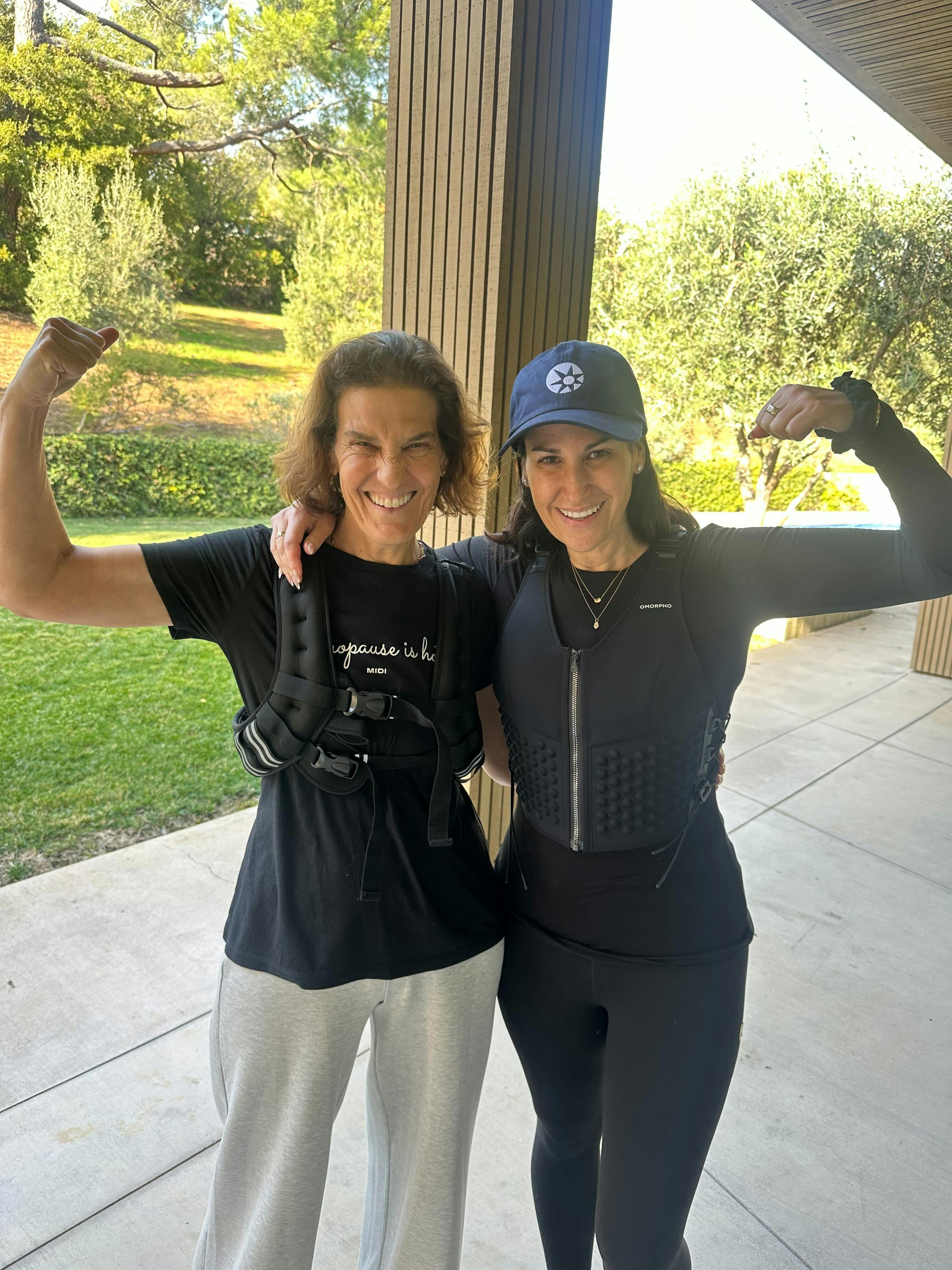 two women, one in a weighted vest