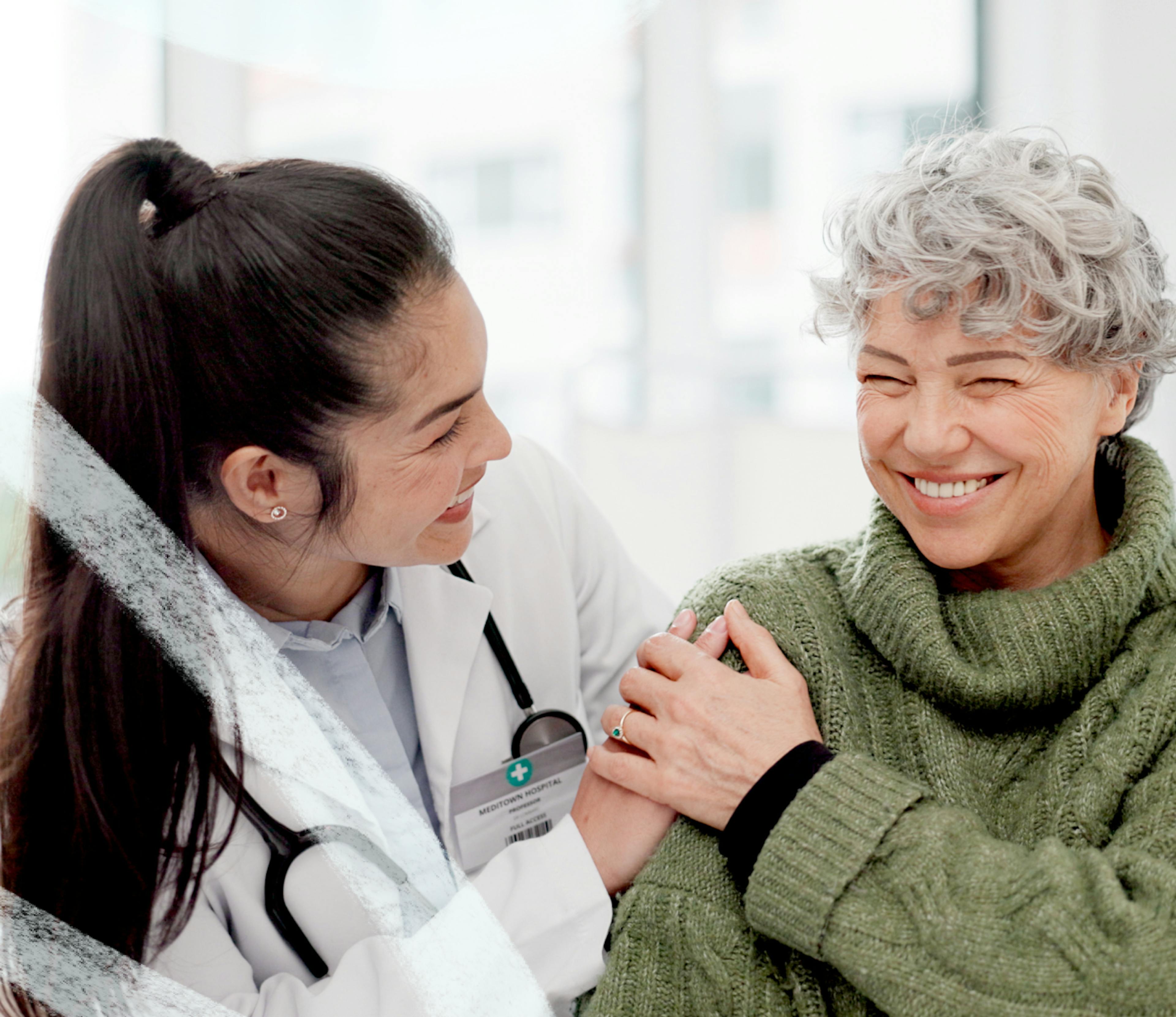 a doctor and a patient talking and smiling