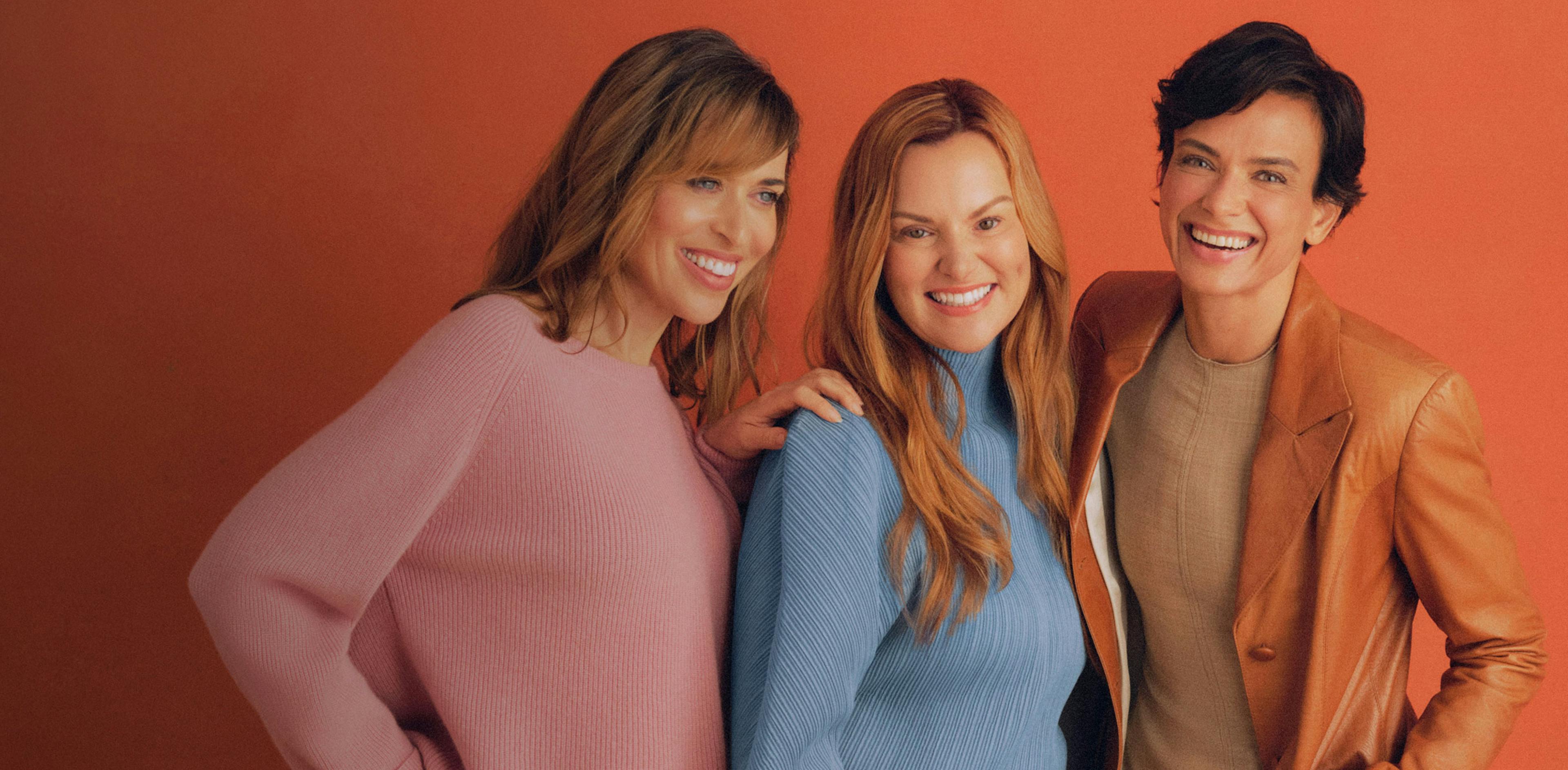 Photograph of three Midi patients smiling together