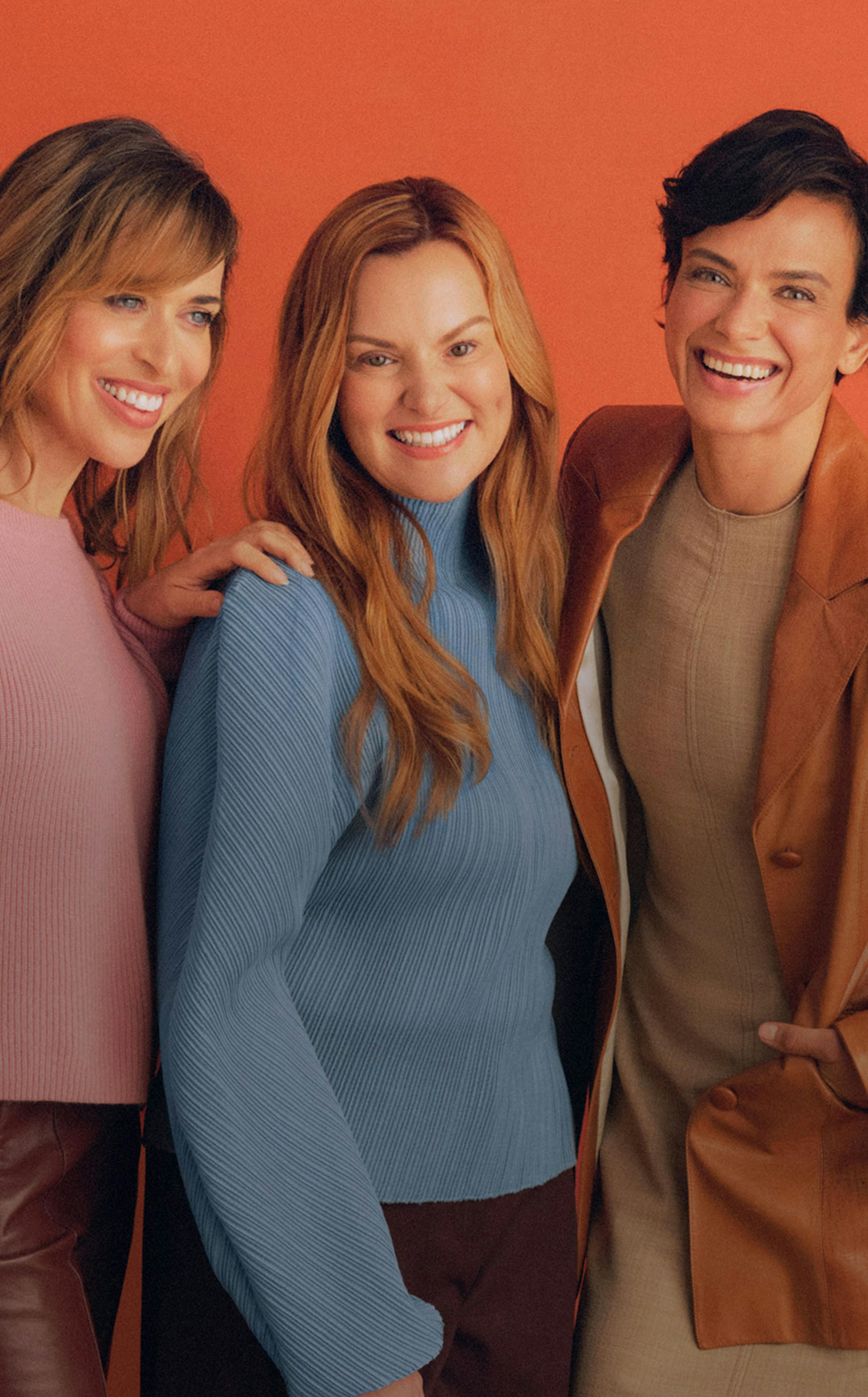 Photograph of three Midi patients smiling together