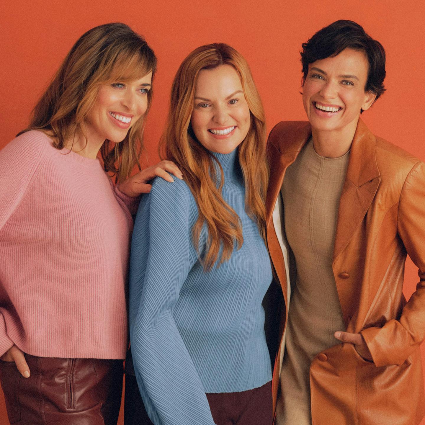 Photograph of three Midi patients smiling together