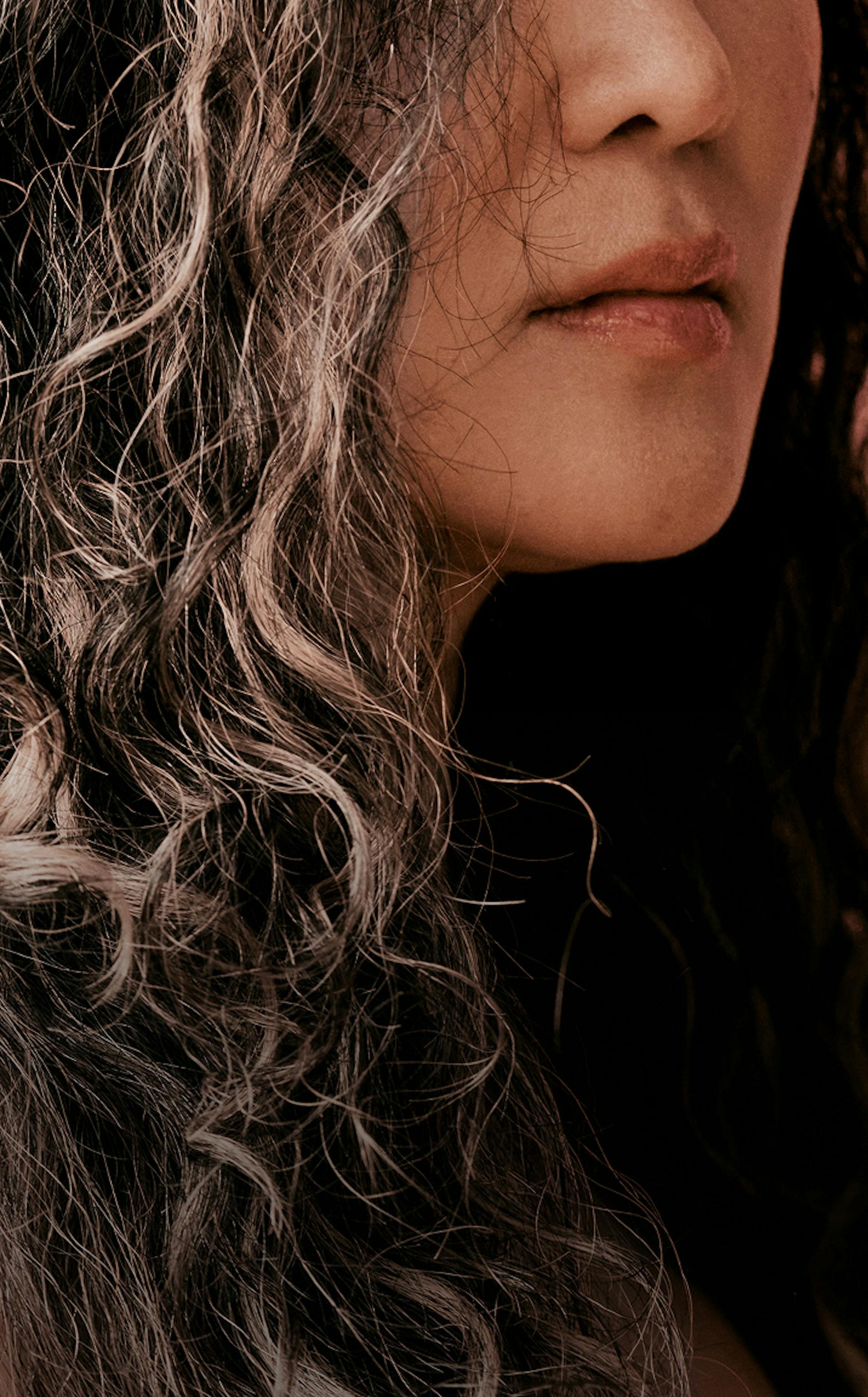 Cropped photograph of woman with curly grey hair