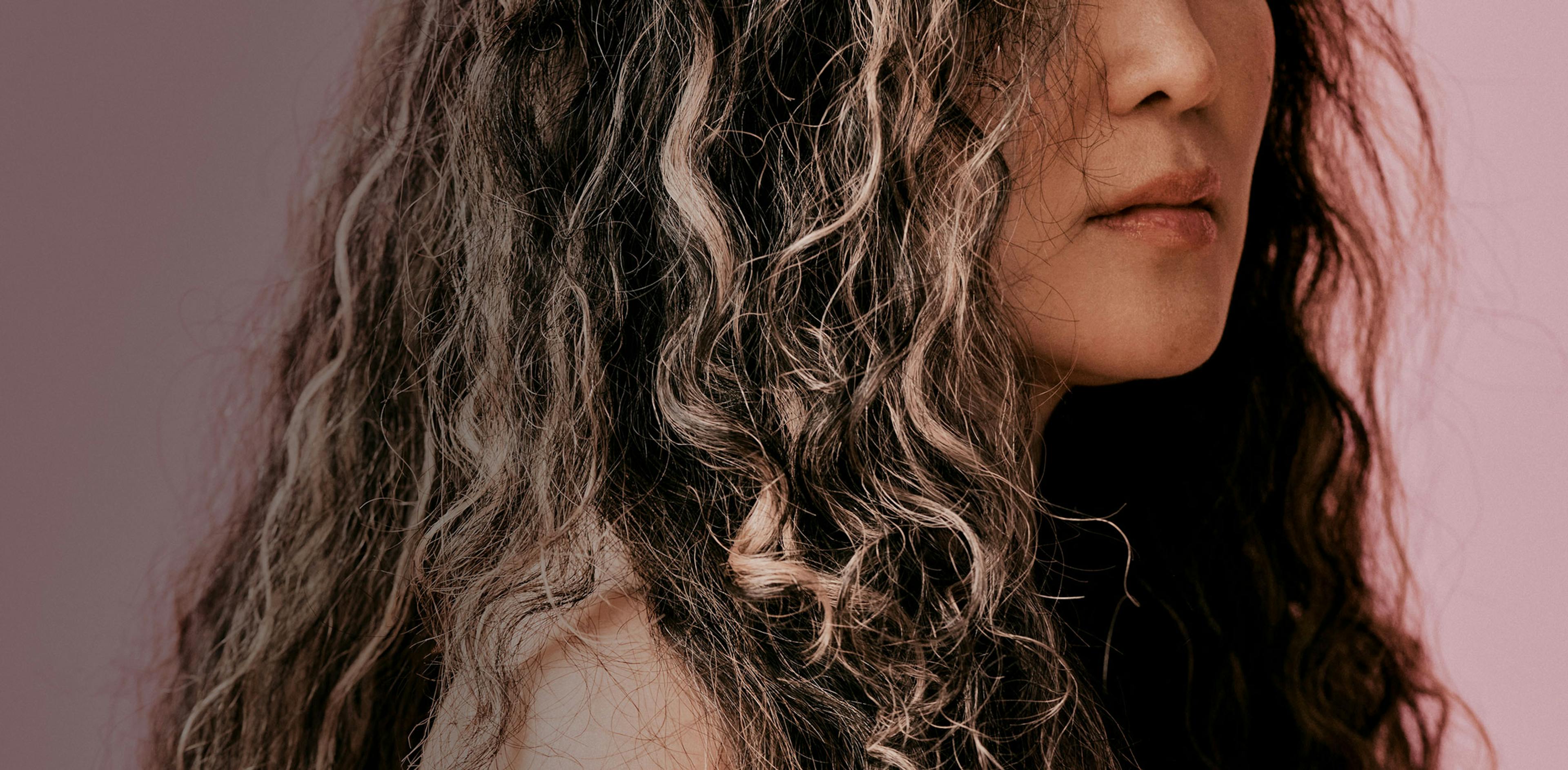 Cropped photograph of woman with curly grey hair