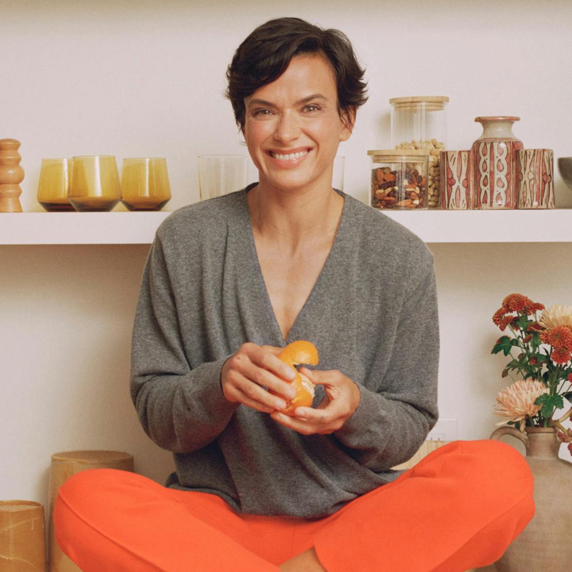 Image of woman sitting and smiling