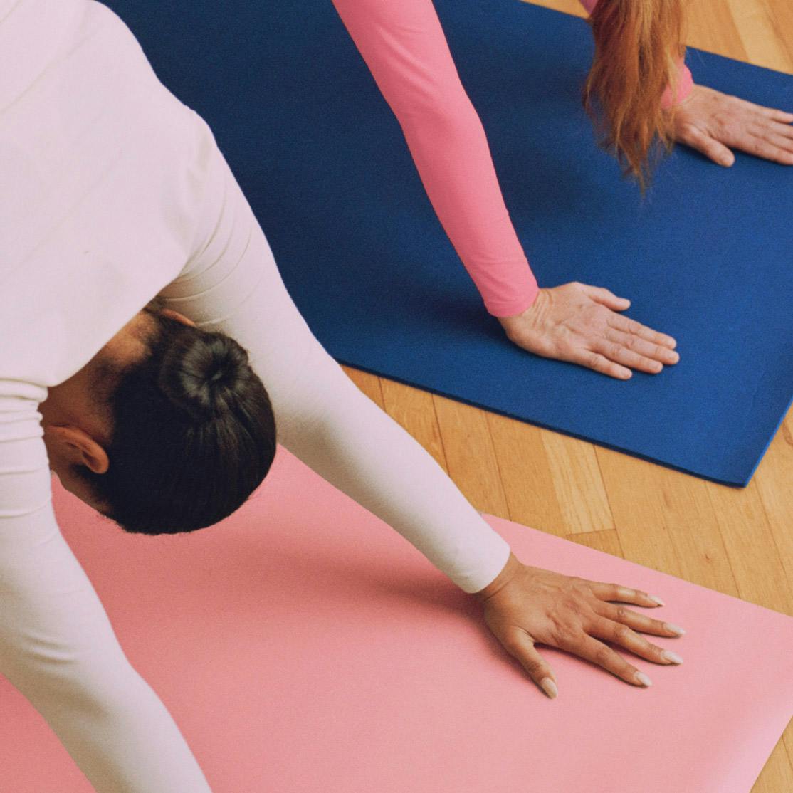 Close crop image of women doing yoga