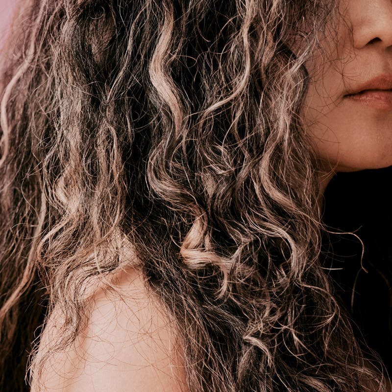 Cropped photograph of woman with curly grey hair