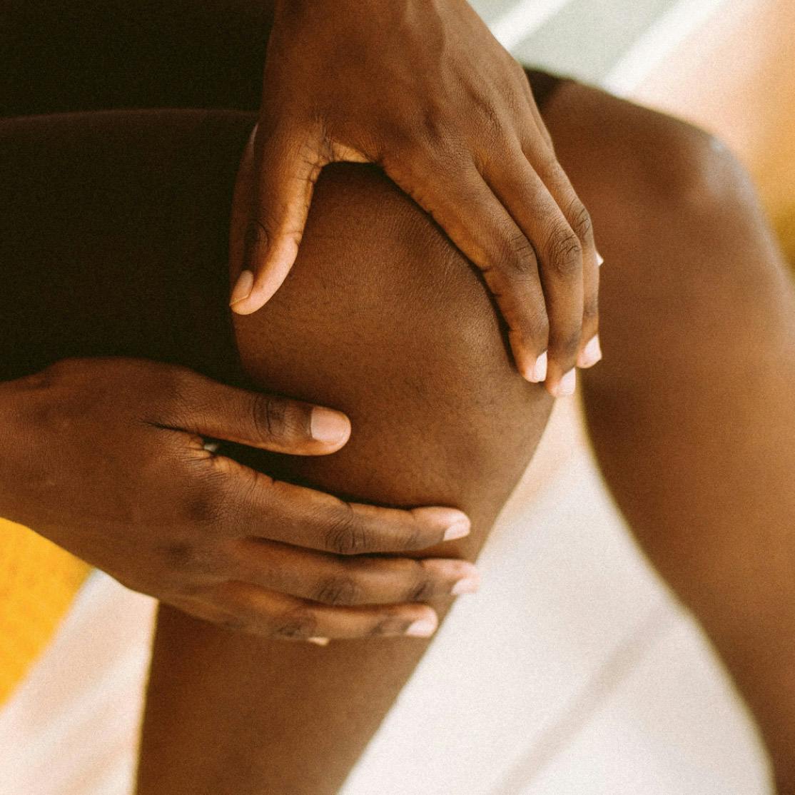 Image of woman's hands on knee