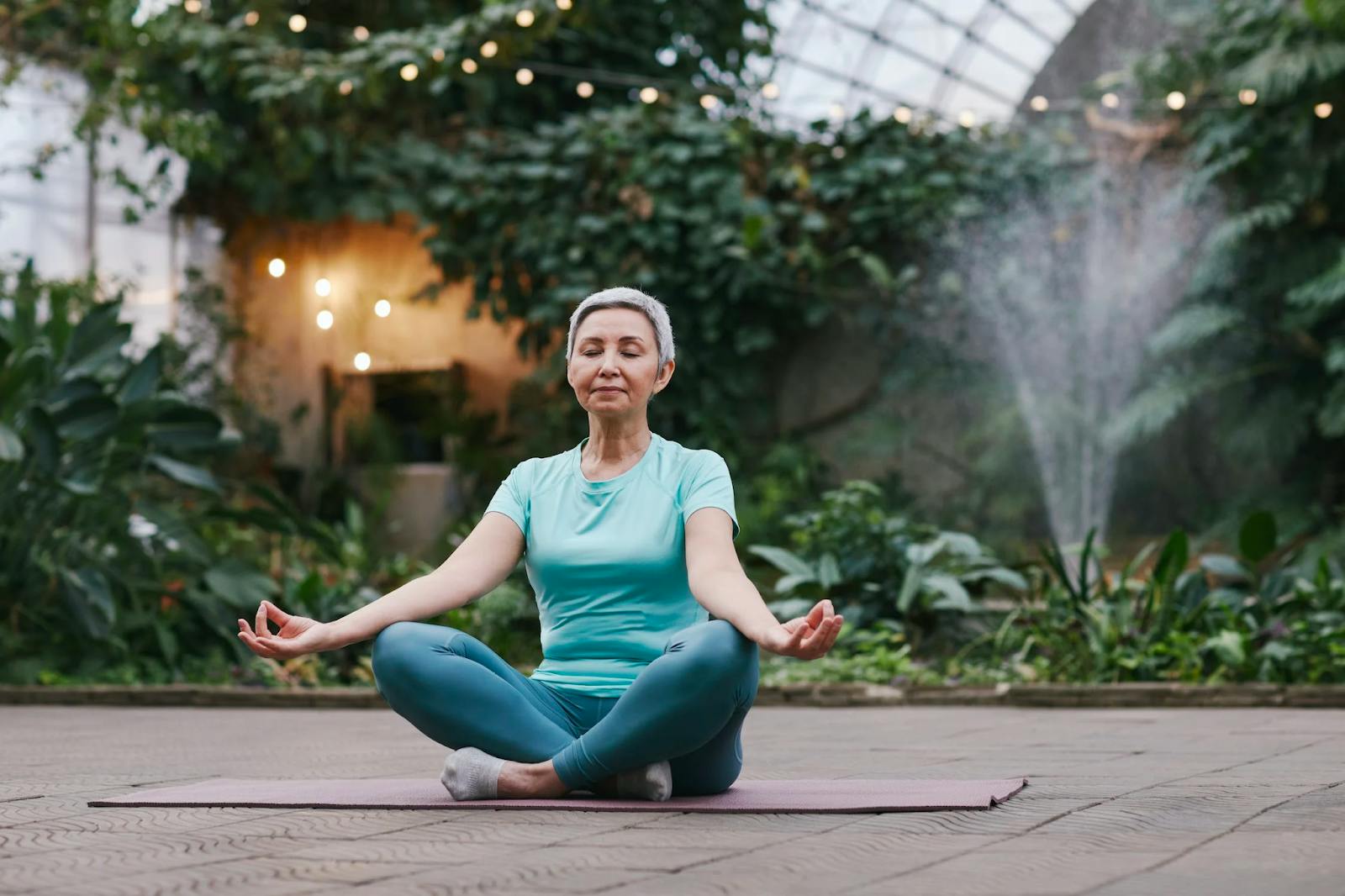 Woman In an atrium doing yoga