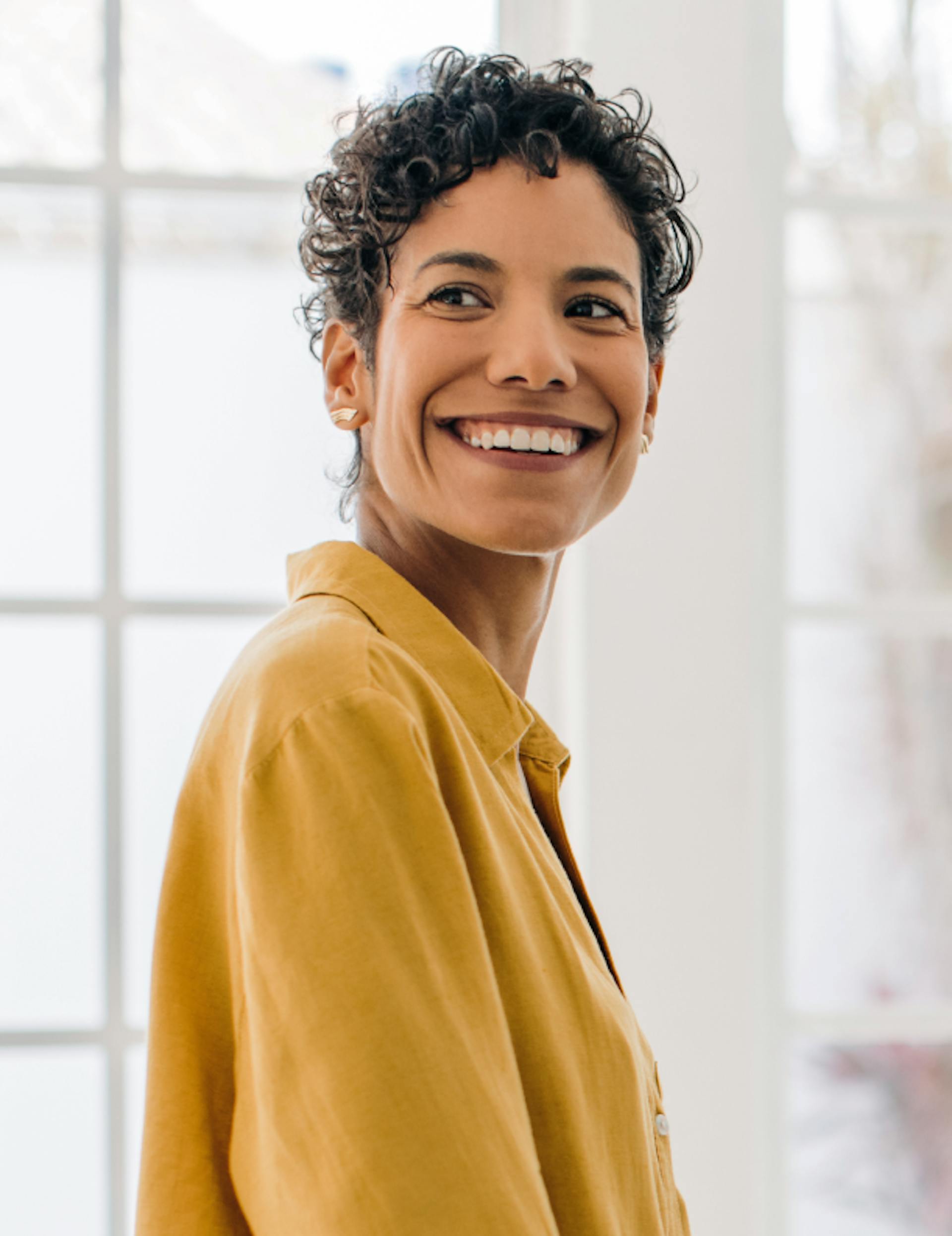 middle aged woman with short hair smiling