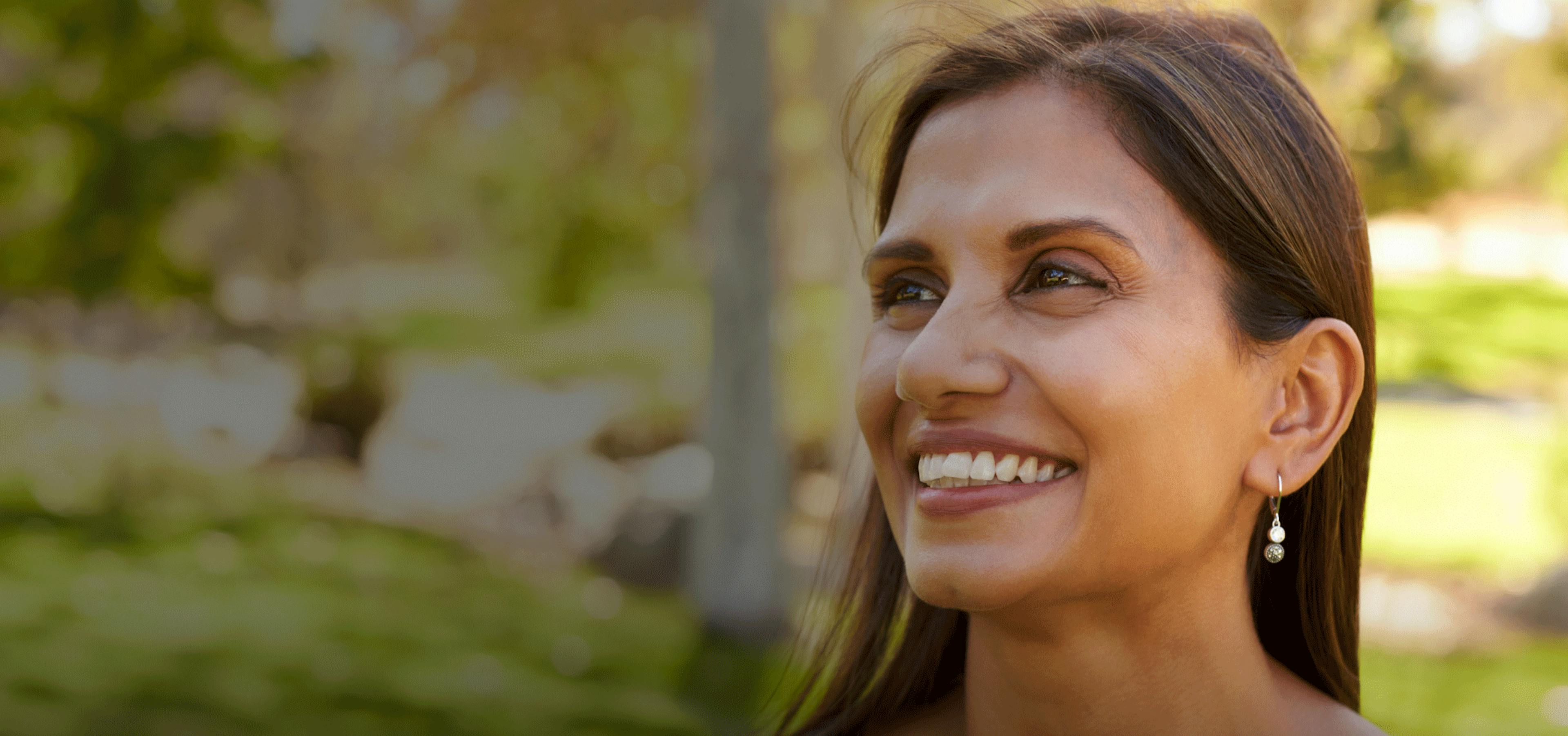 Smiling woman in forest