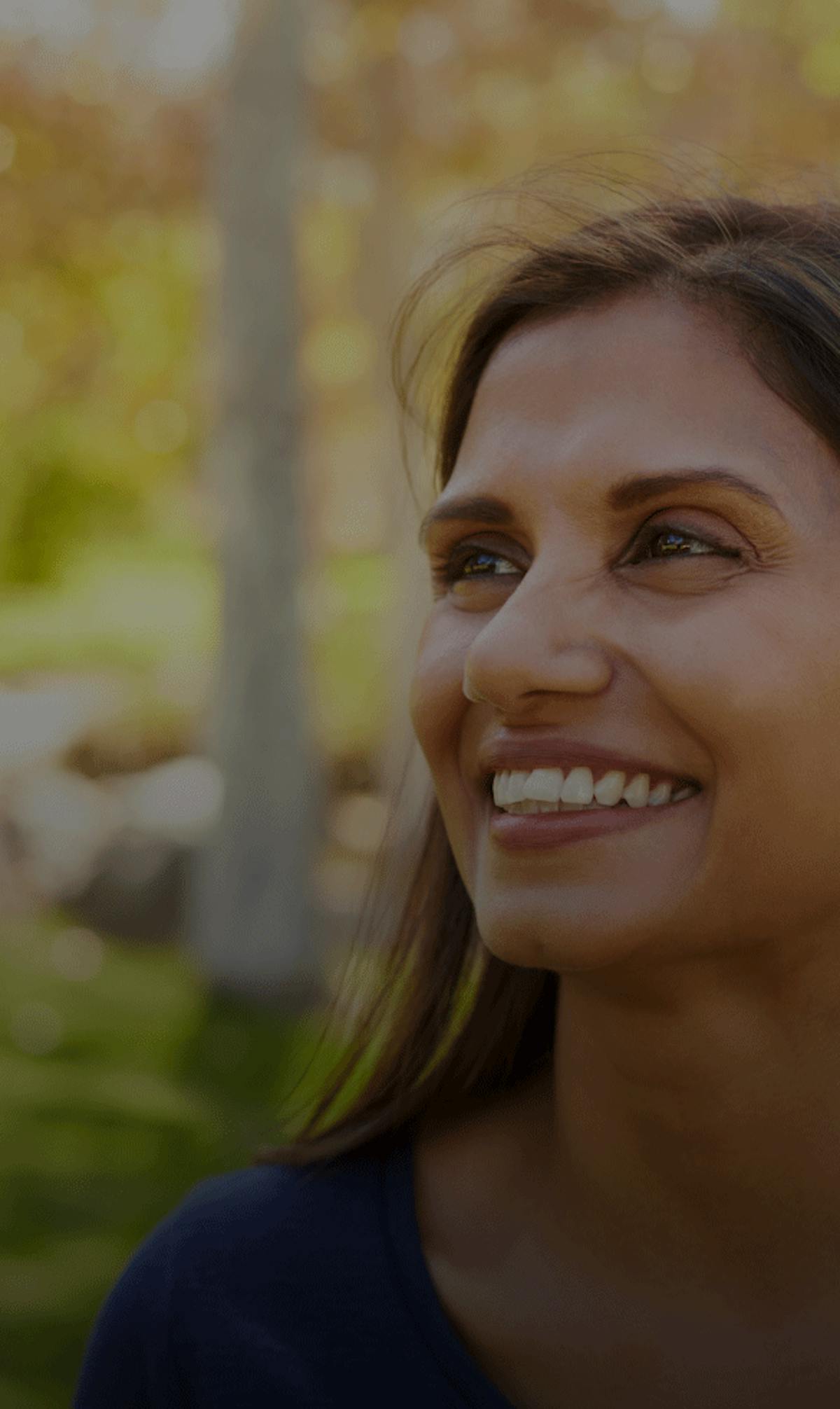 Smiling woman in forest