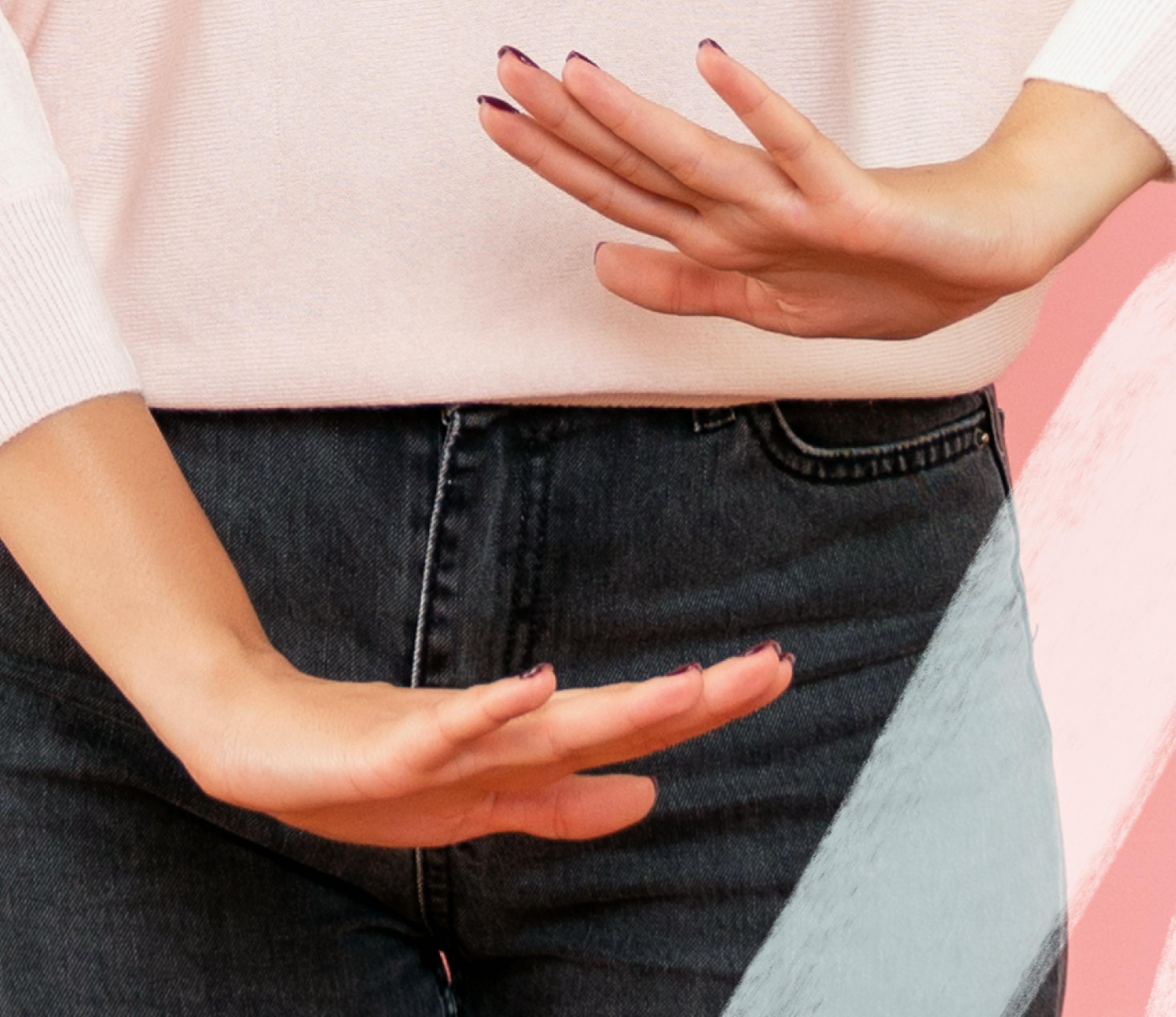 a woman's midsection with two hands one above the other