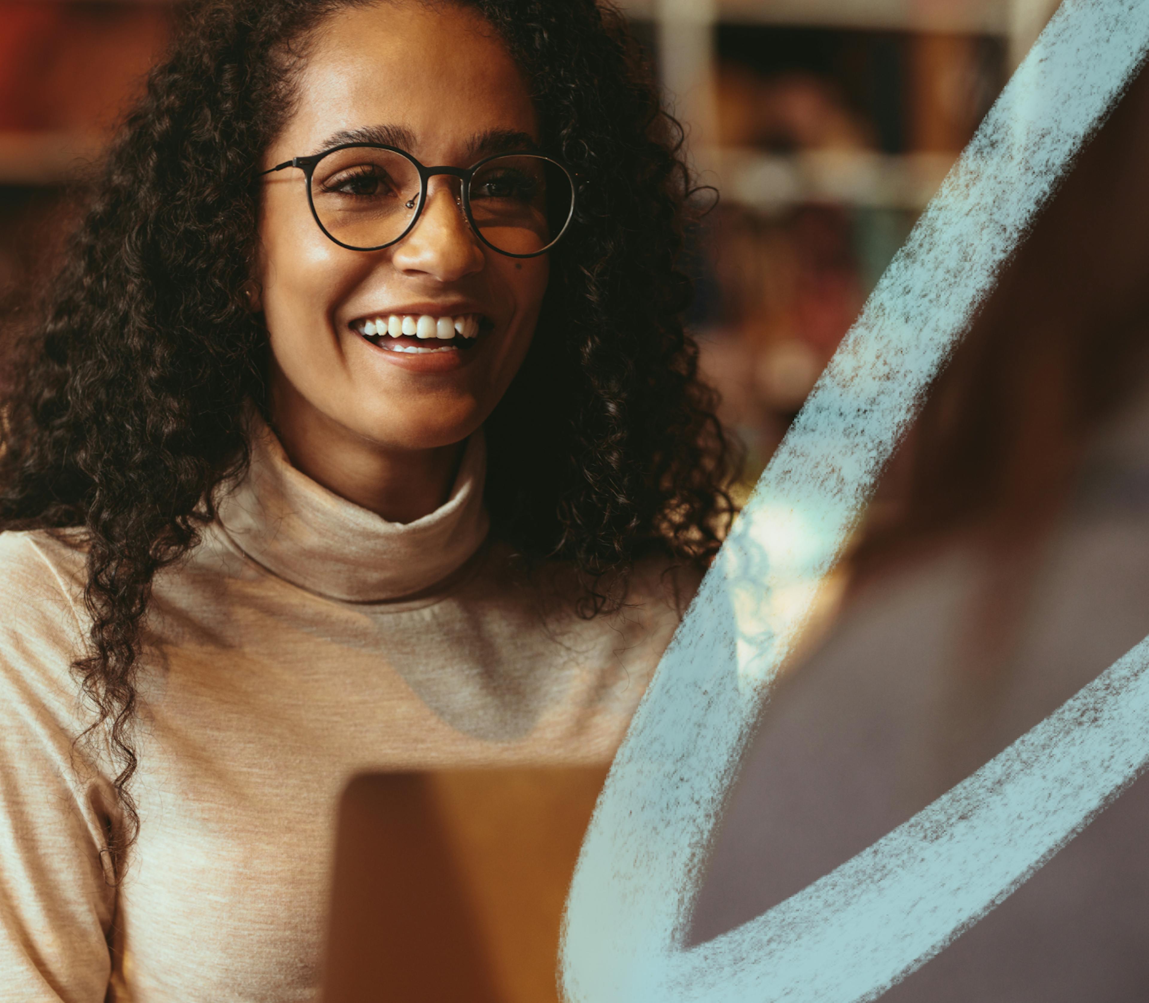 woman with glasses smiling 