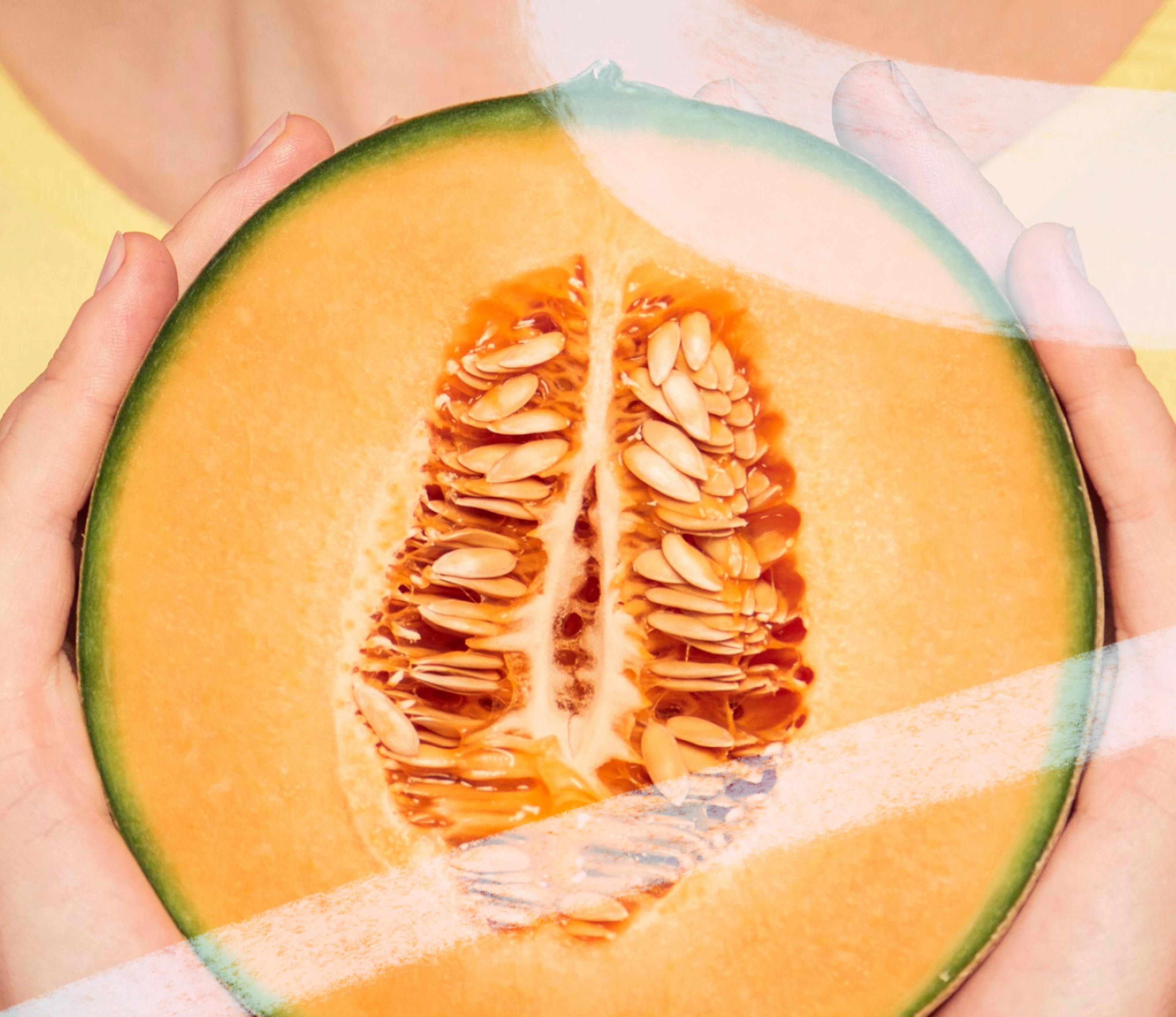 the inside of a cantaloupe, being held in two hands