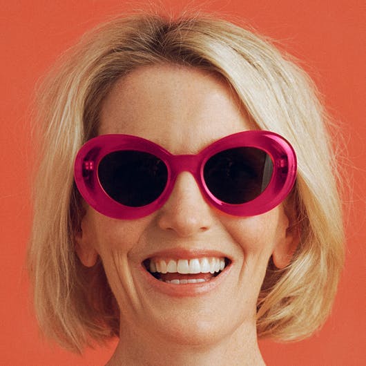 woman with sunglasses smiling