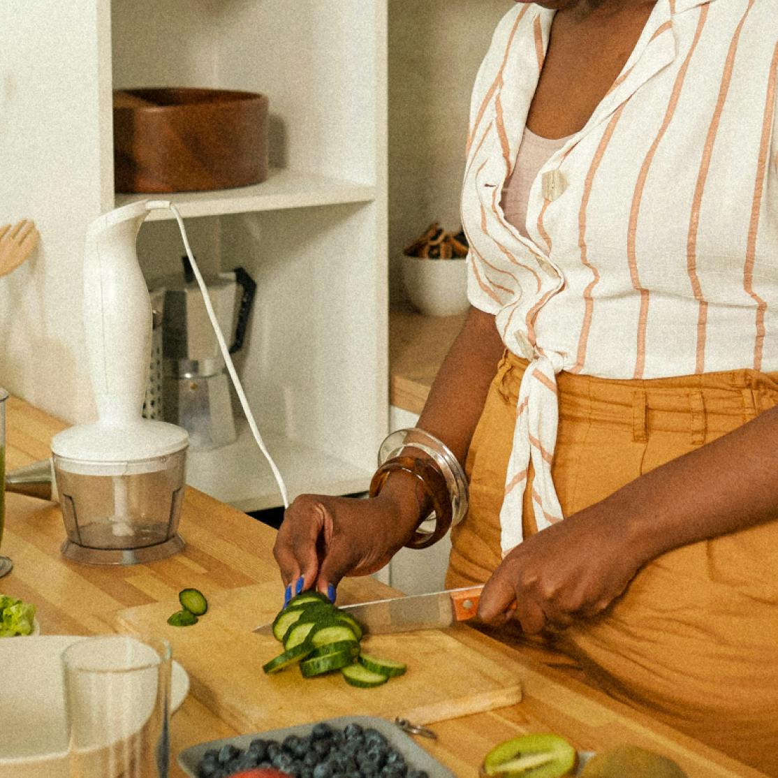 image showing a woman shopping cucumbers