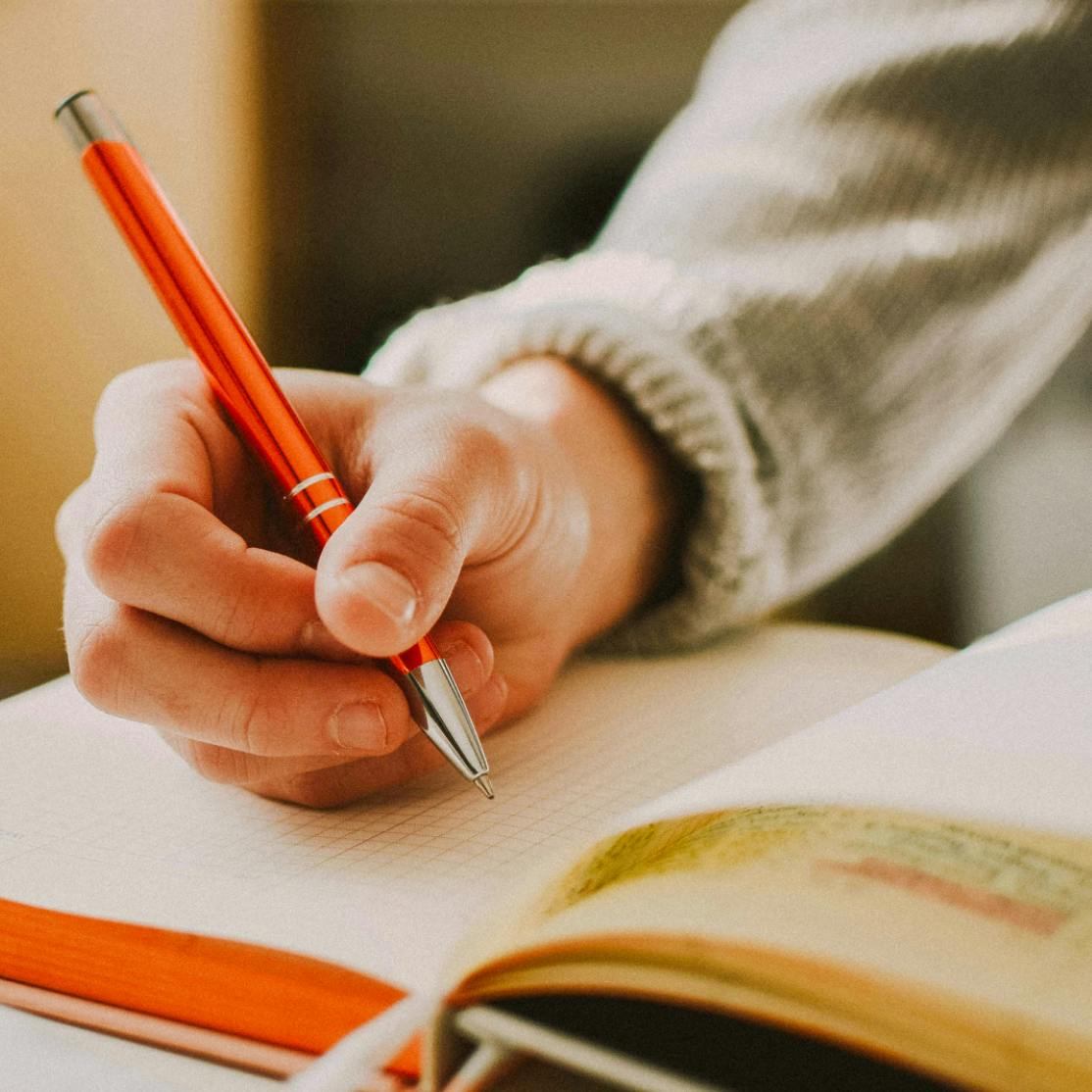 woman writing down her perimenopause symptoms