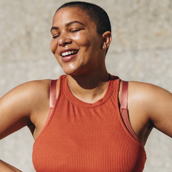 woman smiling with eyes closed