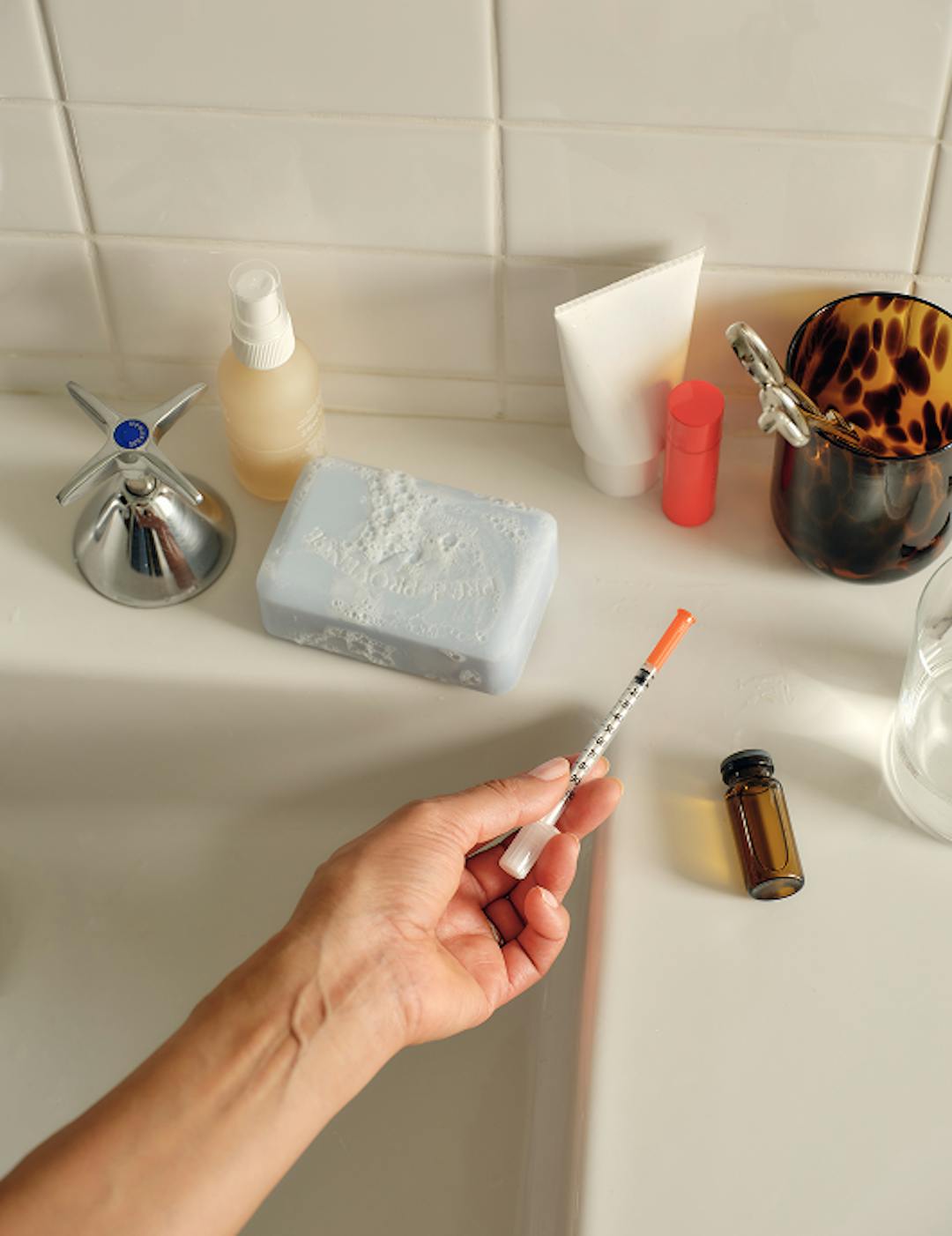 image of a woman with an injectable GLP-1