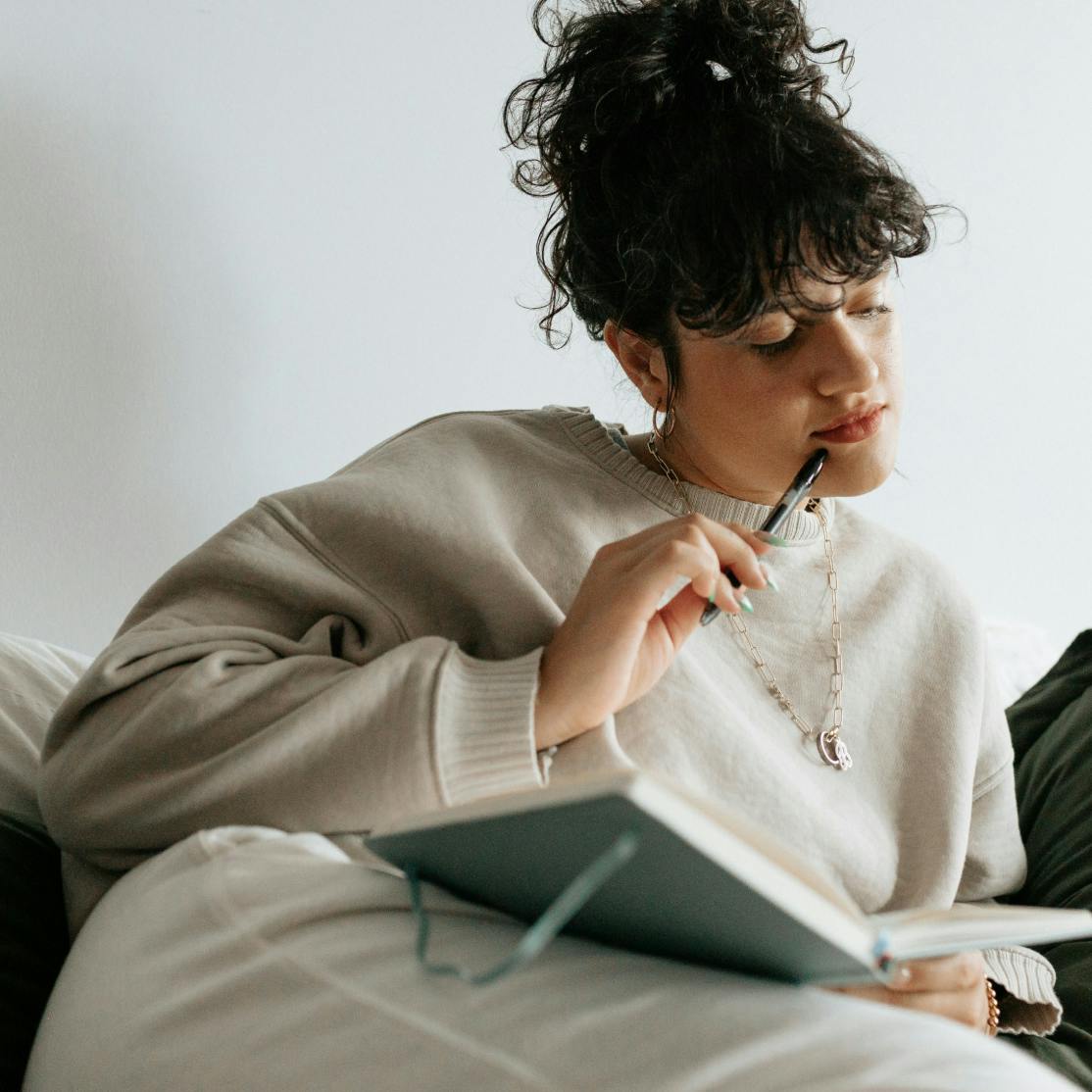 woman in perimenopause journaling