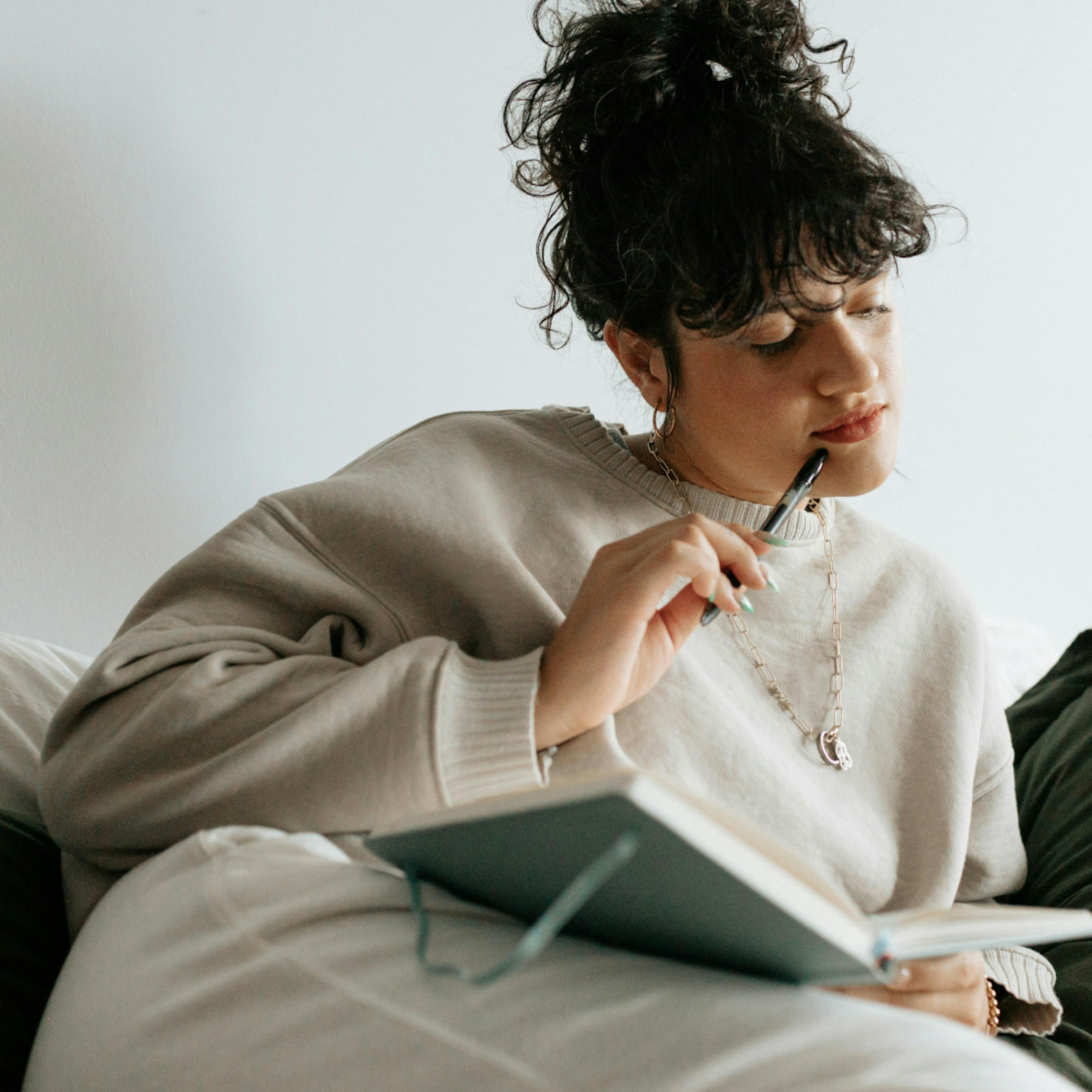 woman in perimenopause journaling