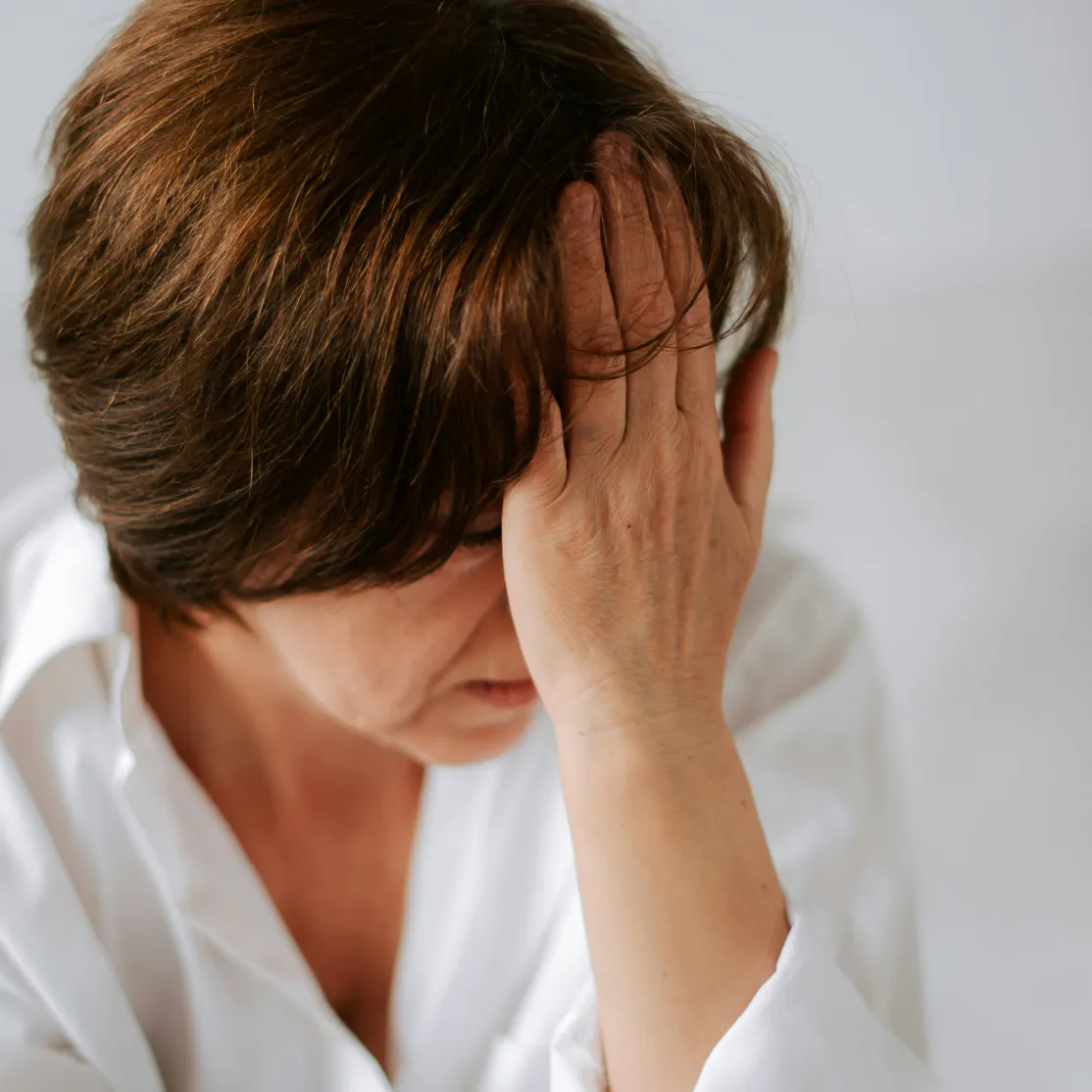 woman holding her head