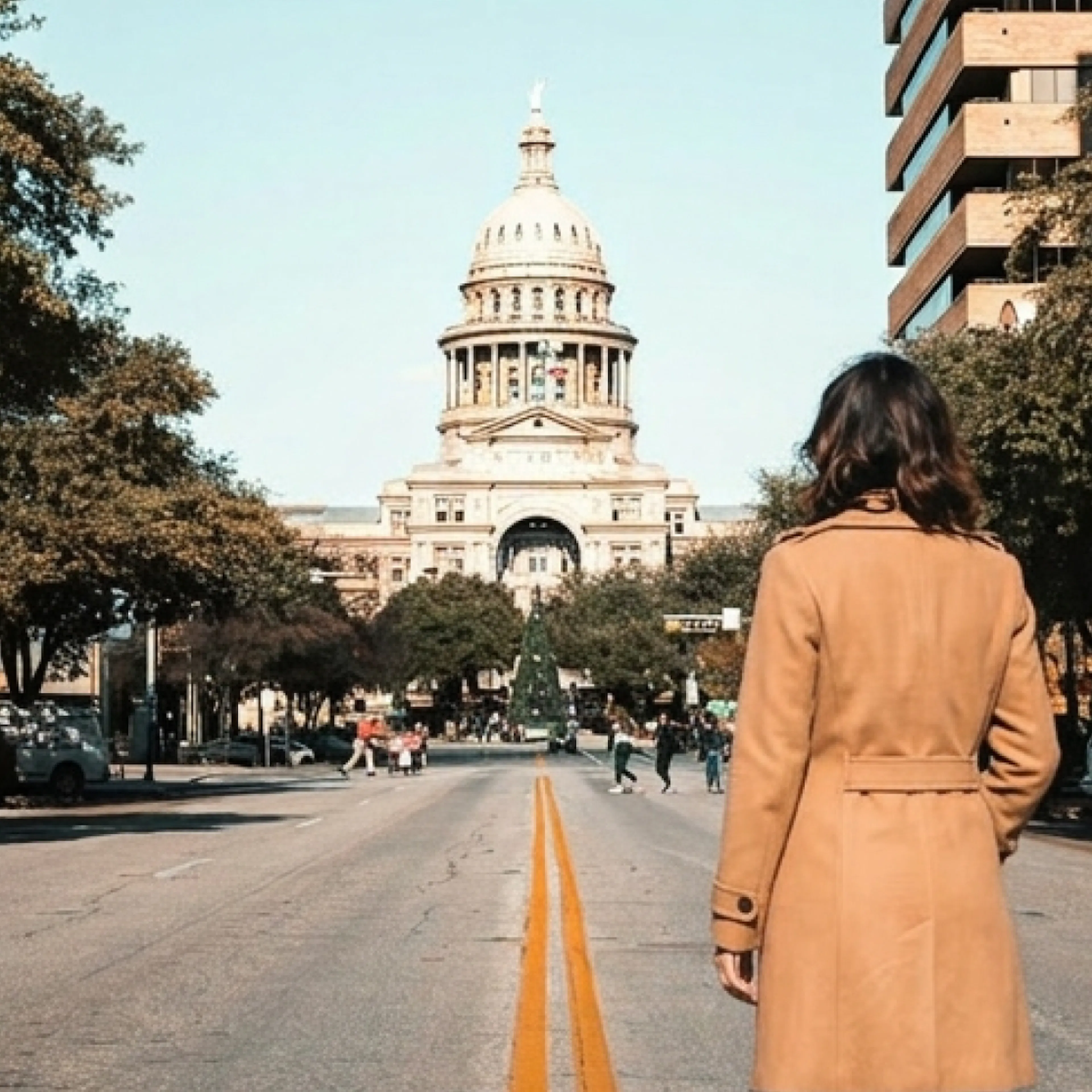 woman standing in front of Austin Capitol Building