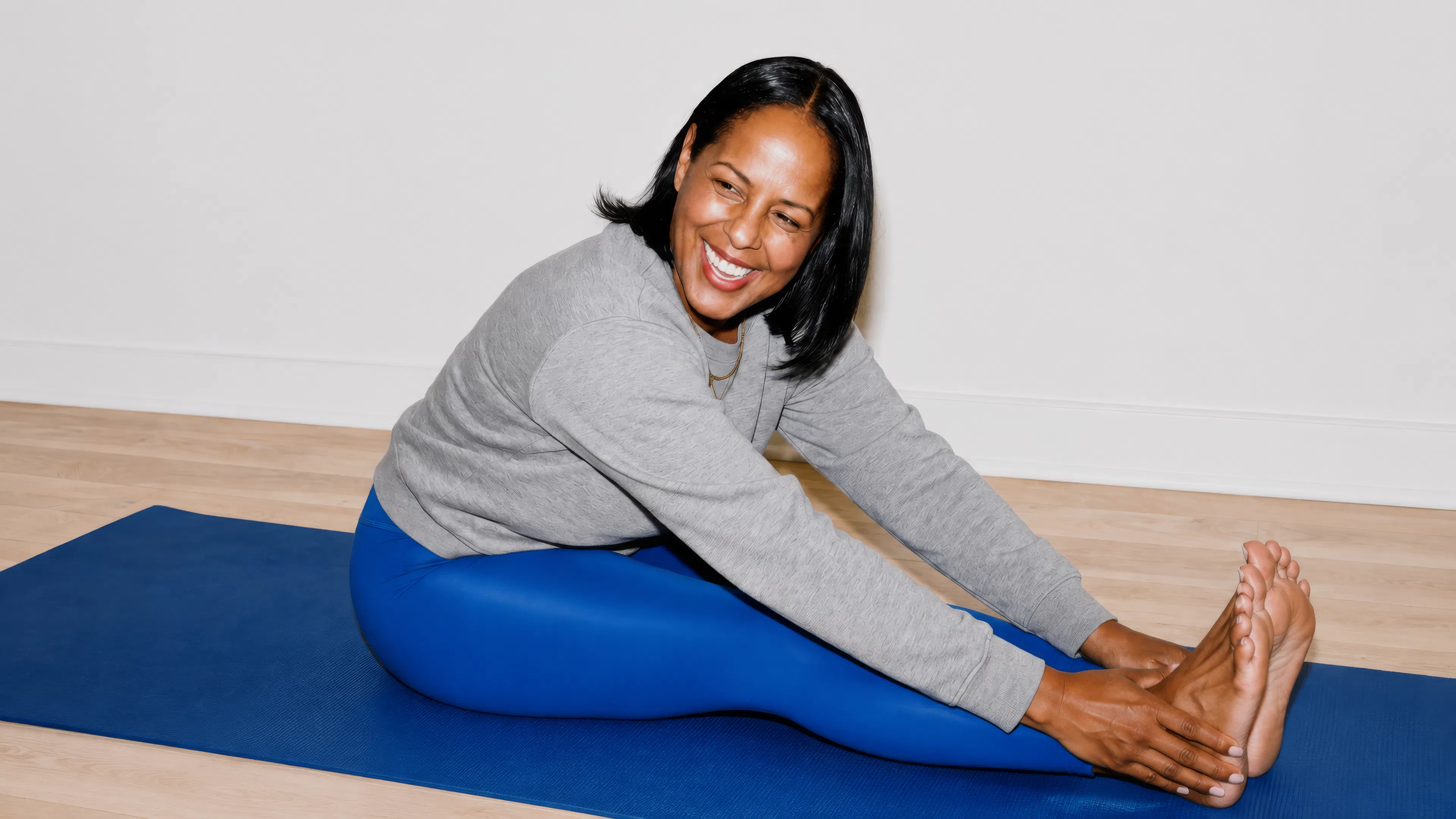 Woman stretching out on a yoga mat