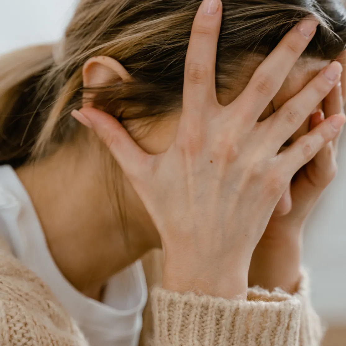 Close-up photo of a woman in midlife experiencing anxiety.