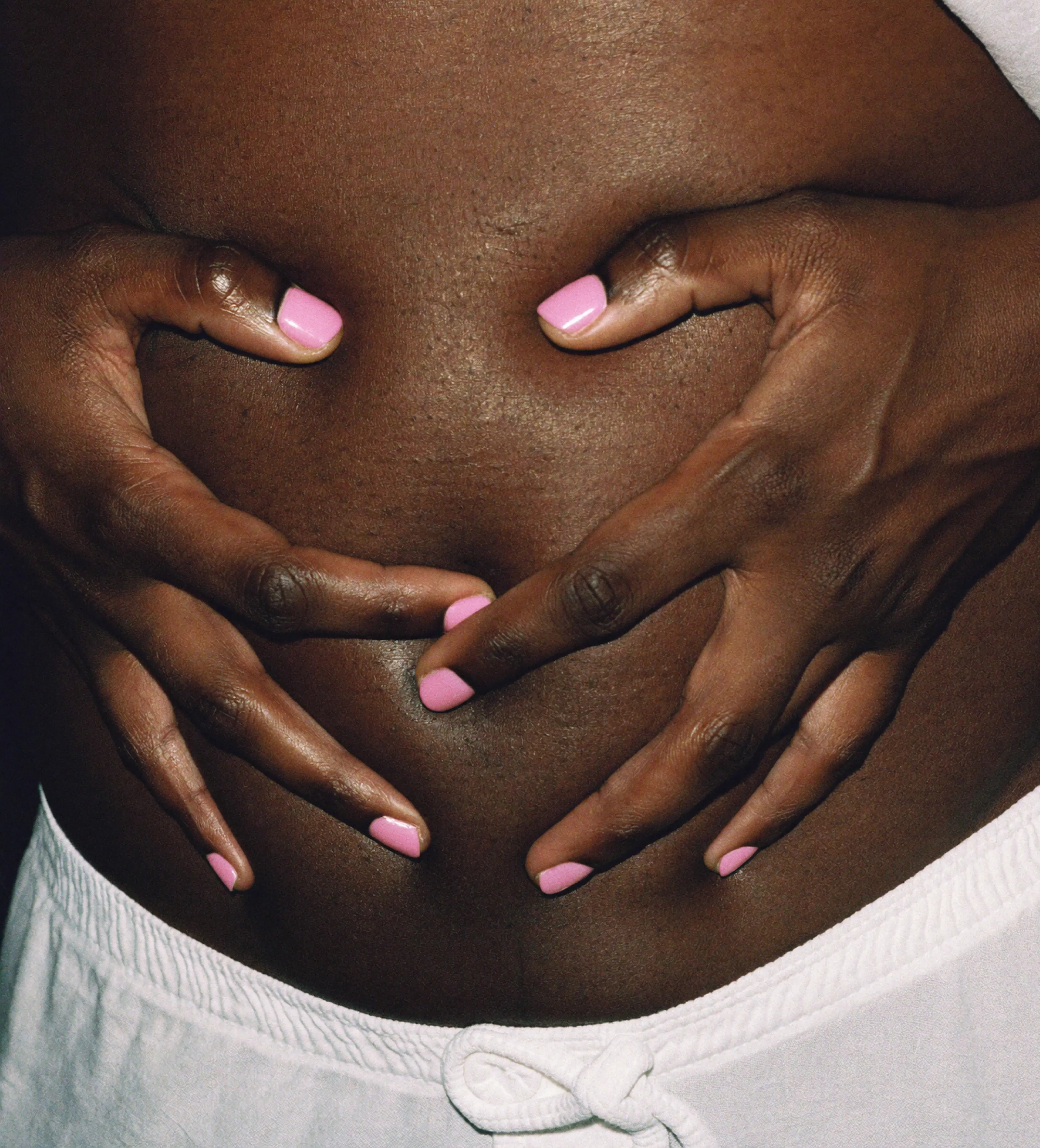 Woman holding her stomach in pain