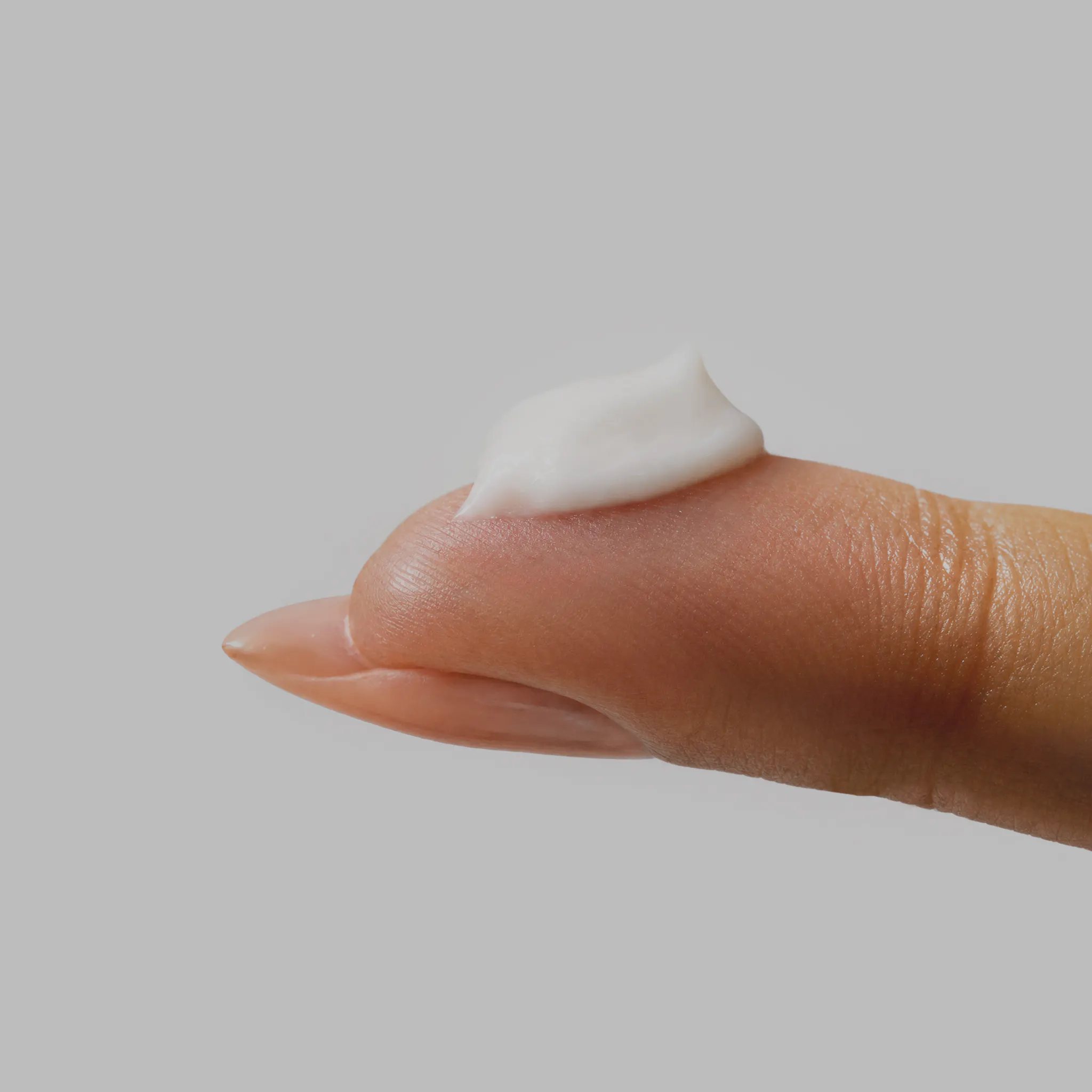 Estriol Face Cream on finger