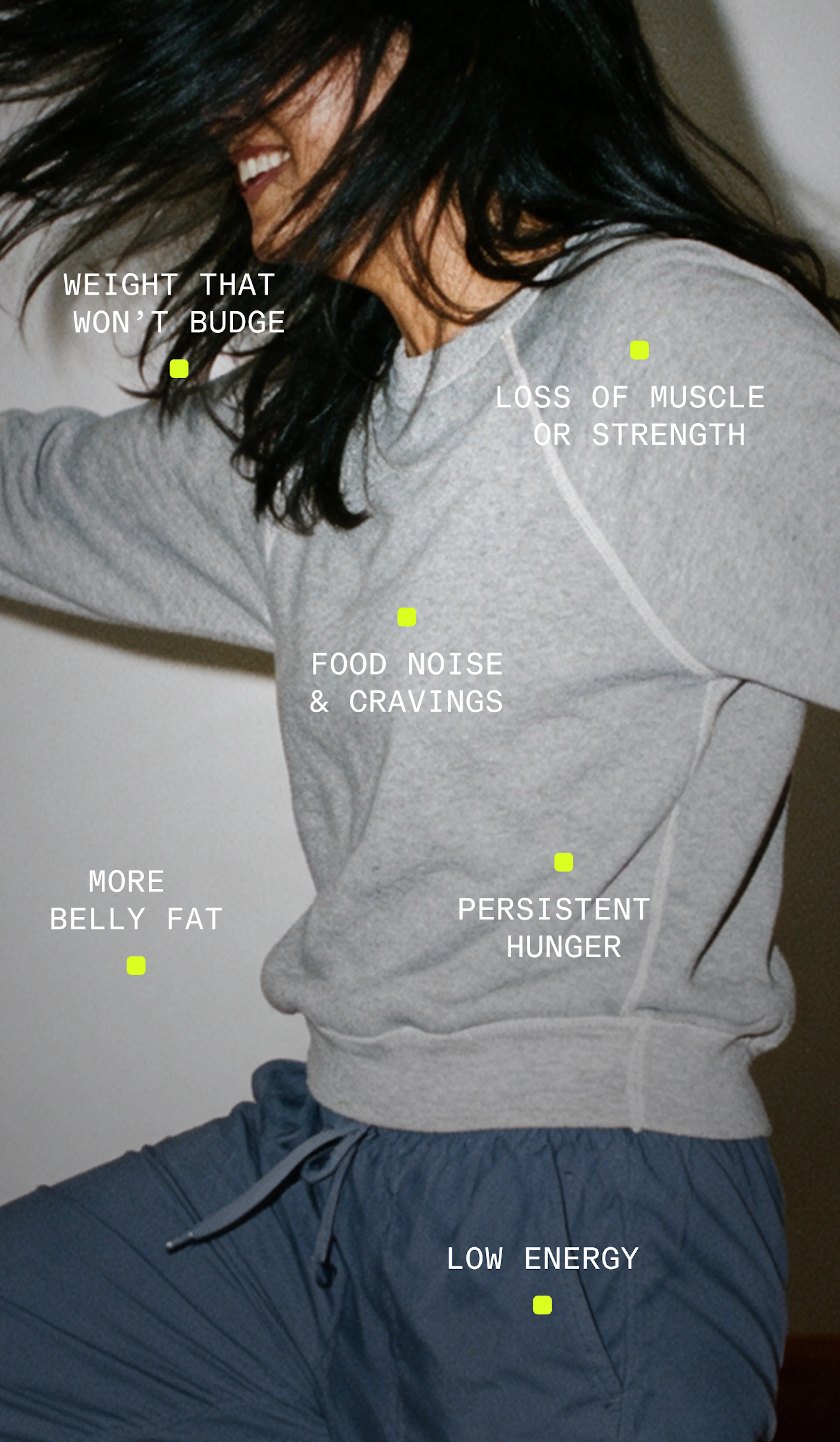 Woman moving playfully in gray sweatshirt