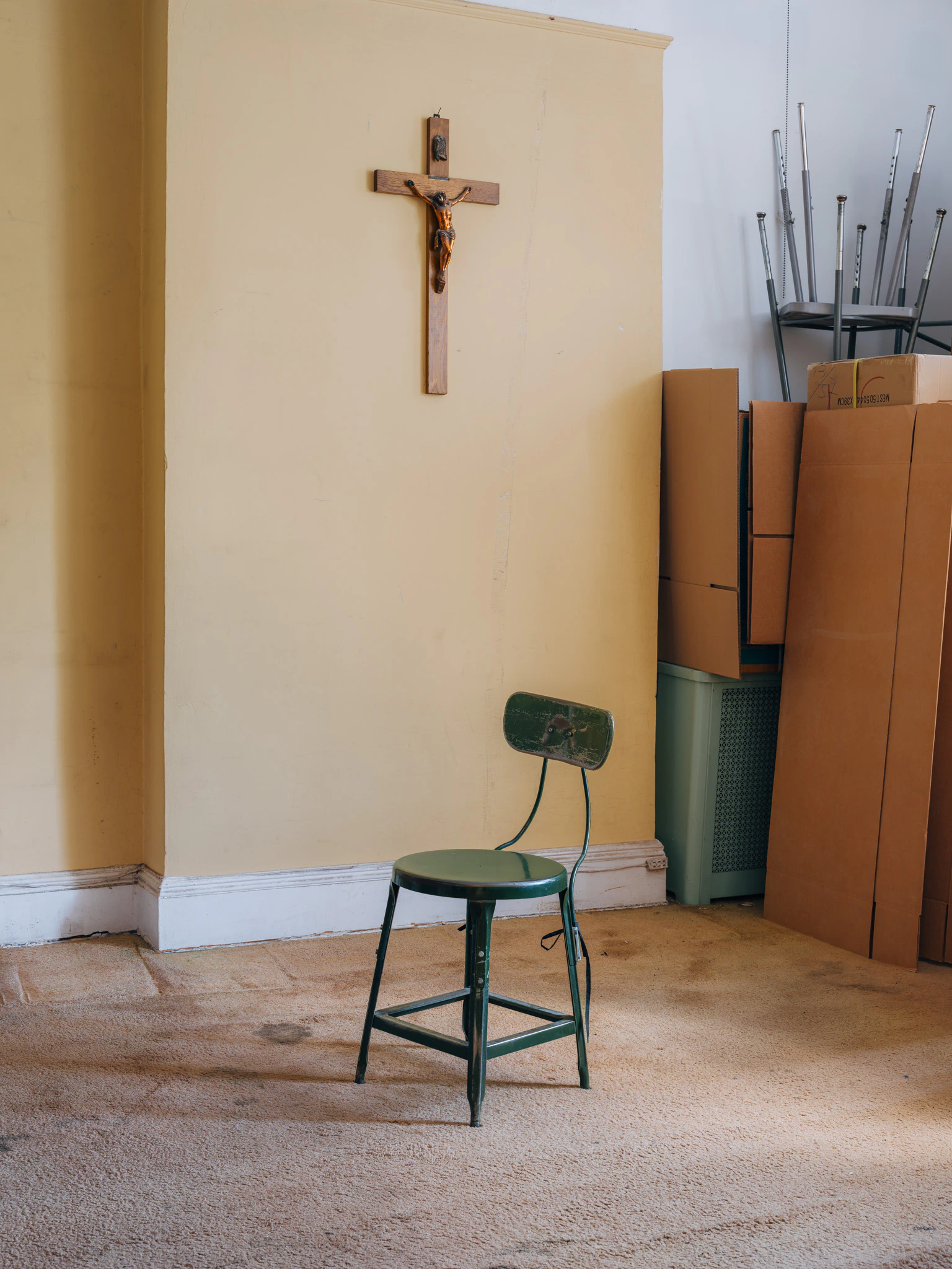 empty green stool in an old bedroom