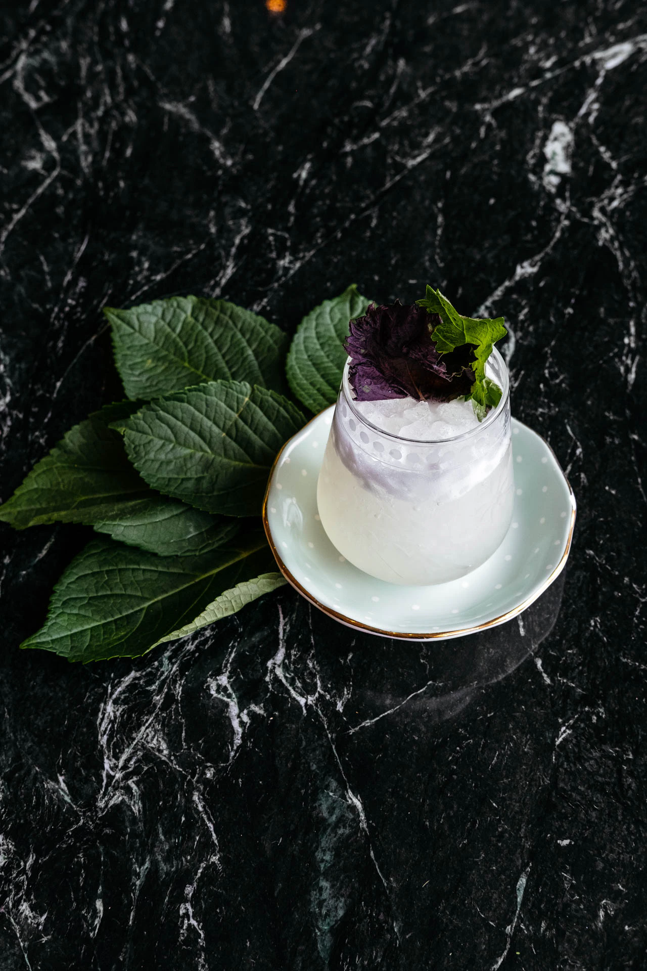 Cocktail and mint leaves