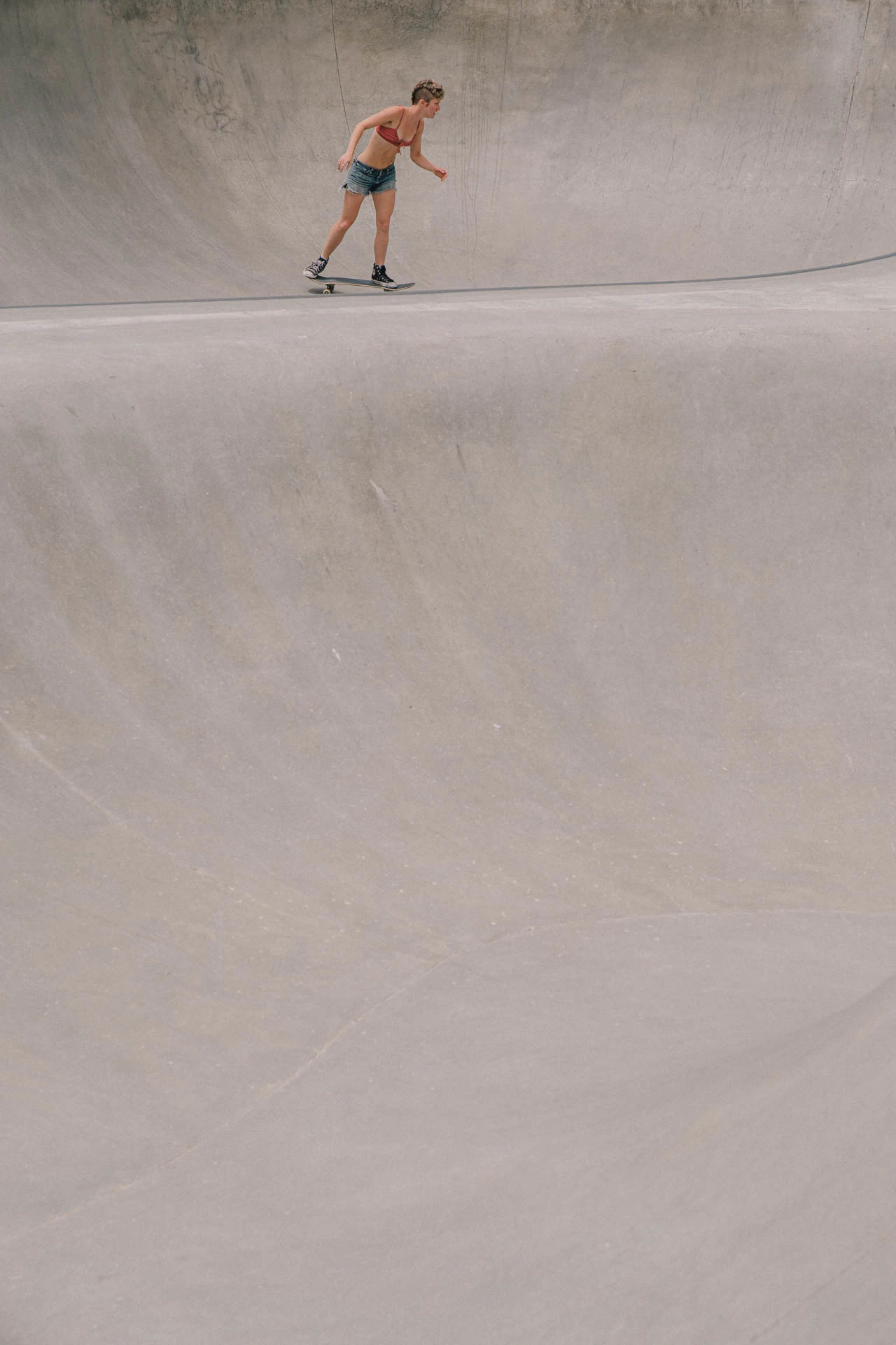 Venice Beach skateboarder in motion on a sunny day by the beach