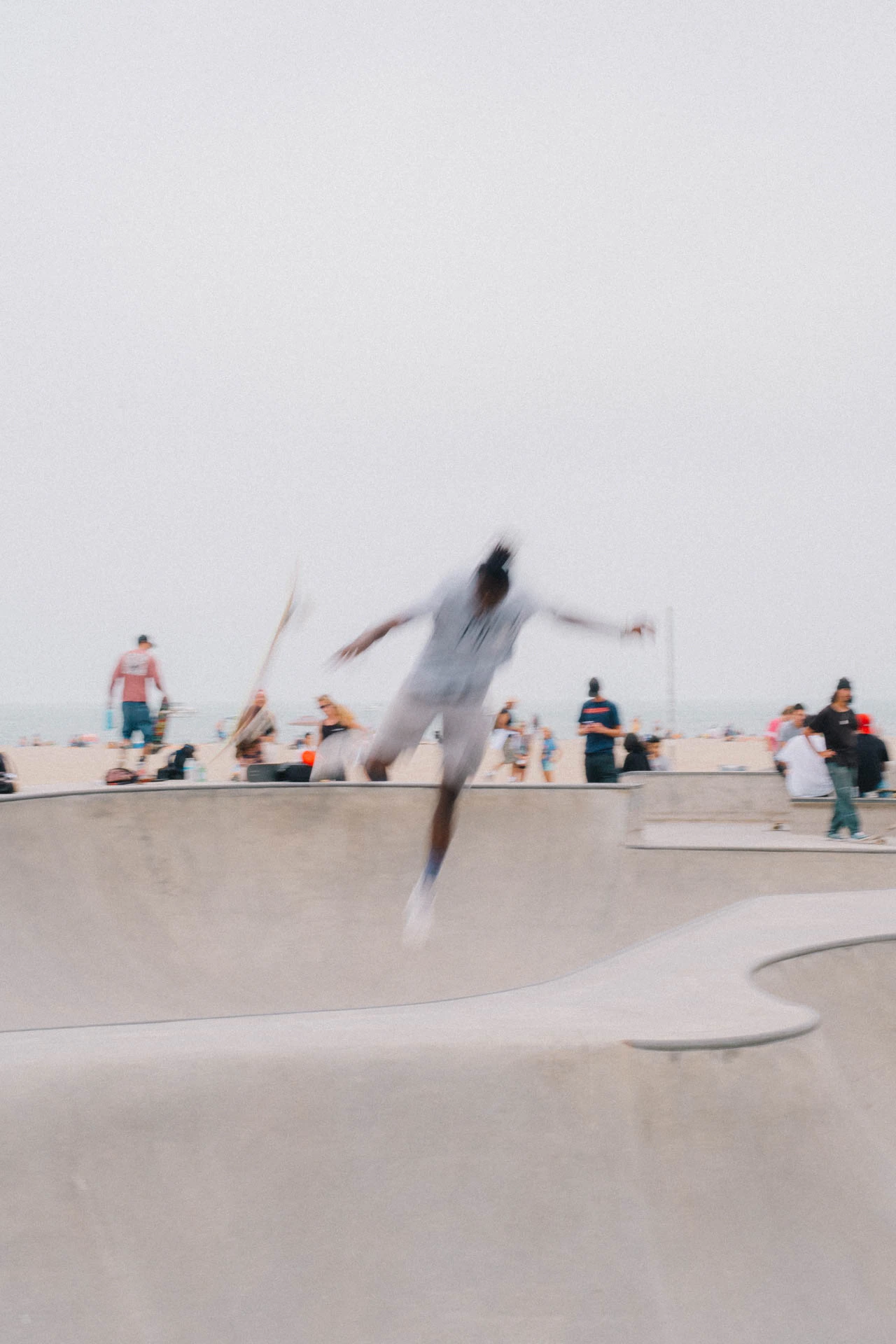 Venice Beach skateboarder in motion on a sunny day by the beach