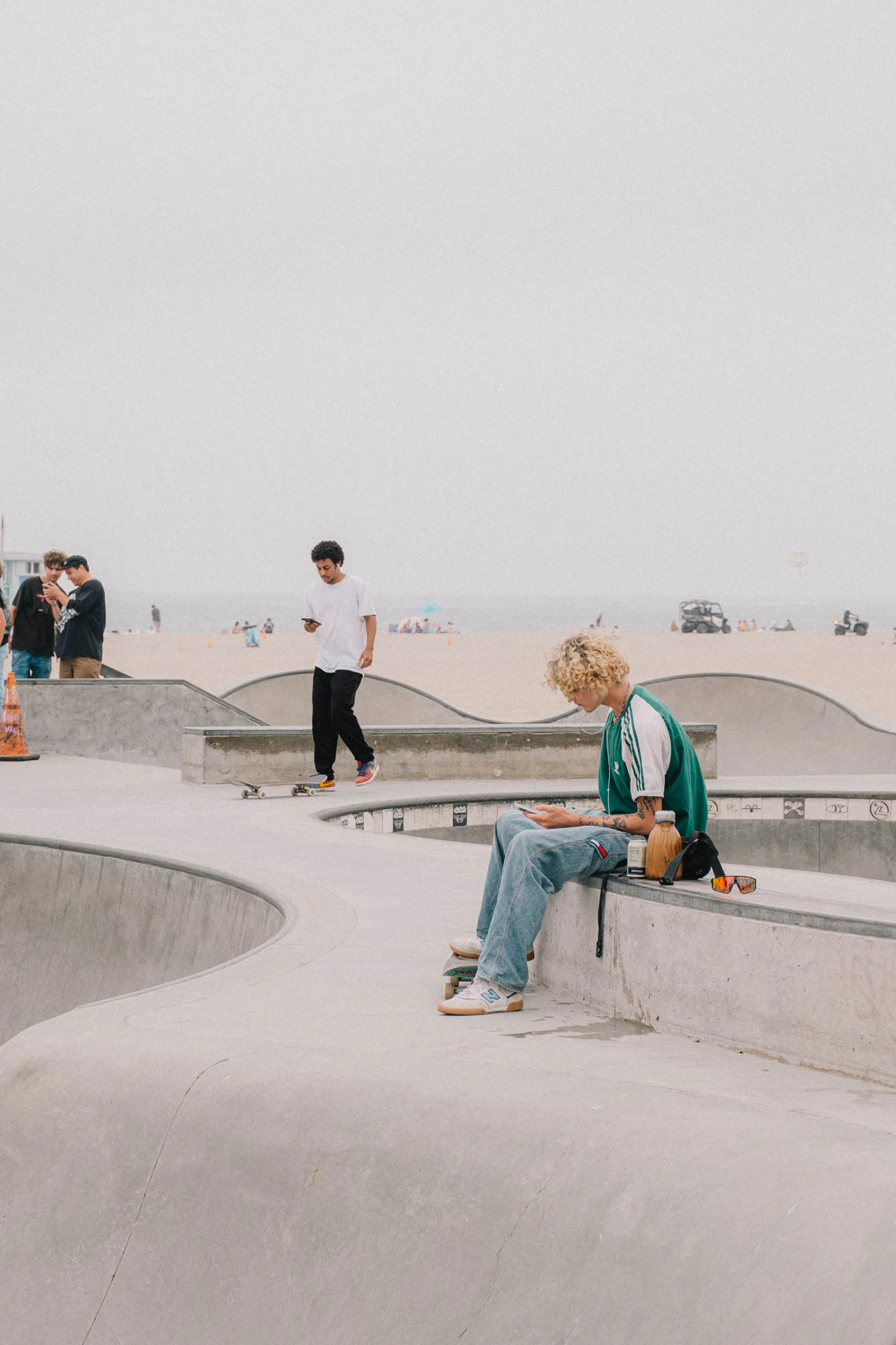 Venice Beach skateboarder taking a break on a sunny day by the beach