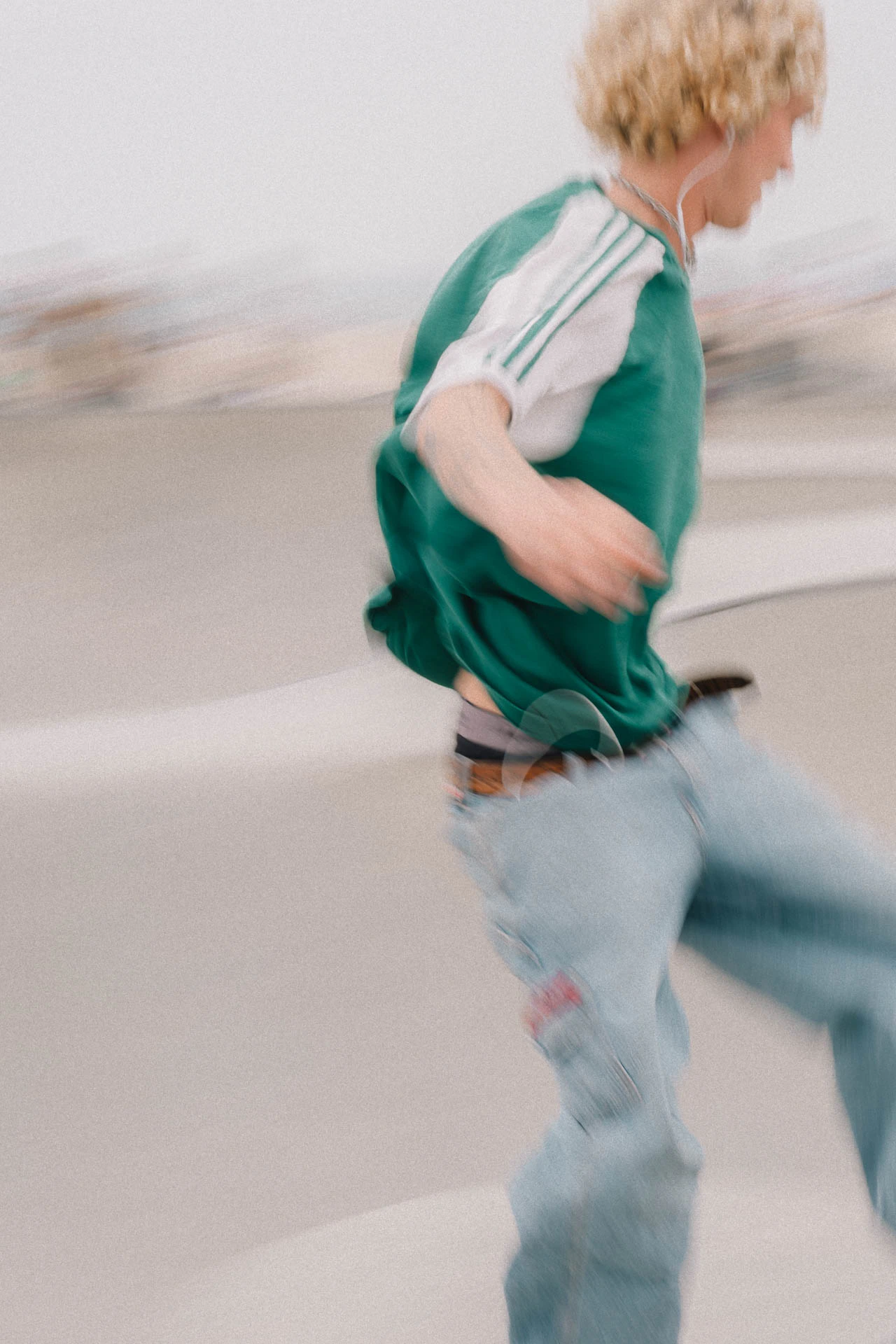 Venice Beach skateboarder in motion on a sunny day by the beach