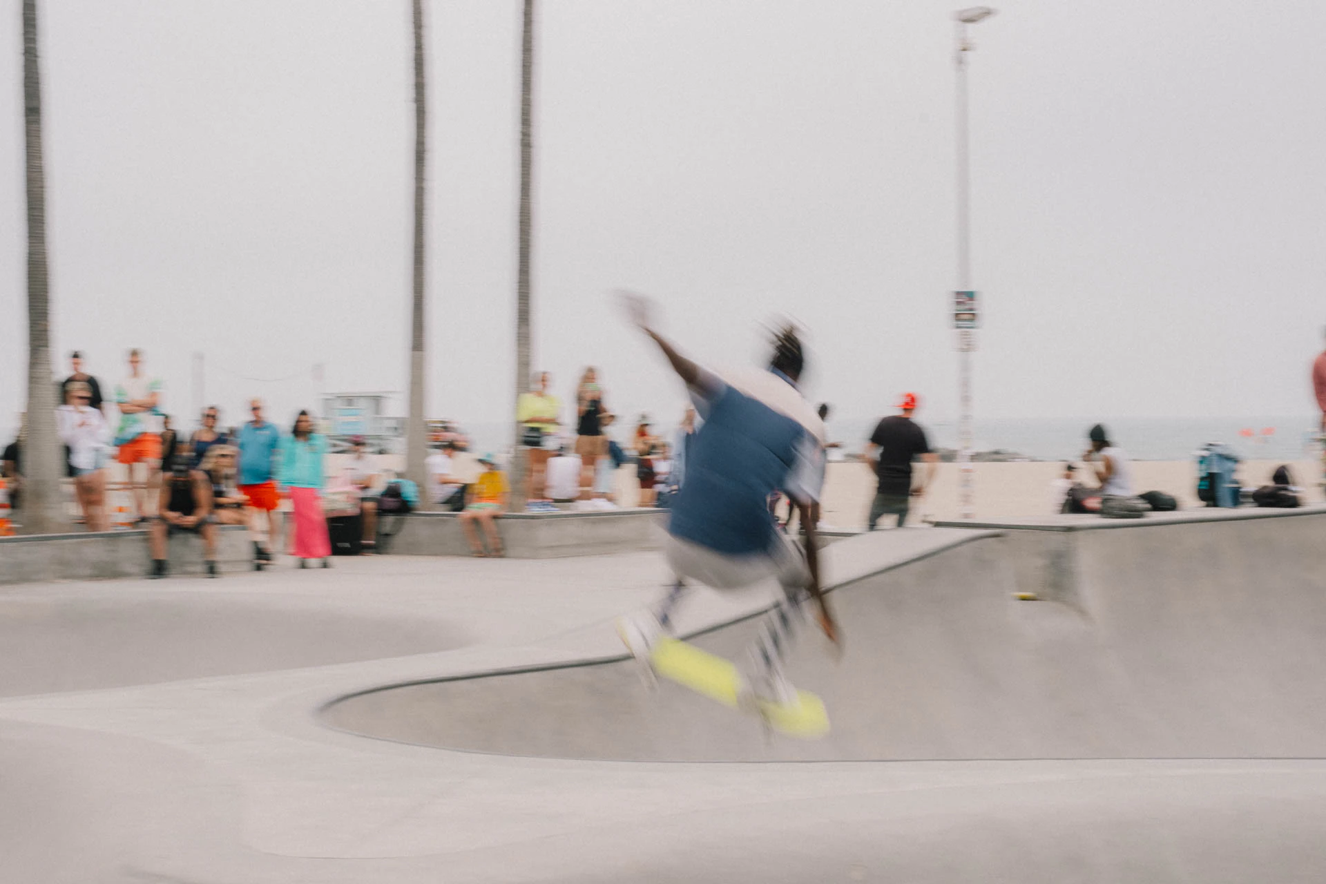 Venice Beach skateboarder in motion on a sunny day by the beach