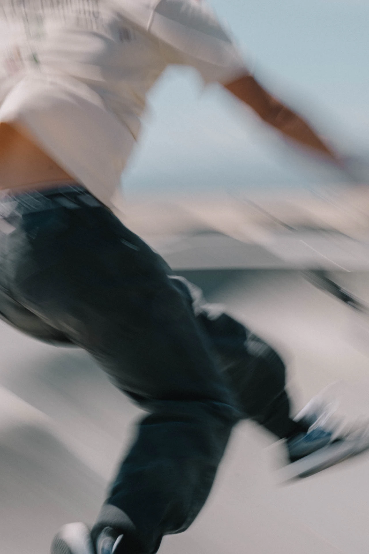 Venice Beach skateboarder in motion on a sunny day by the beach