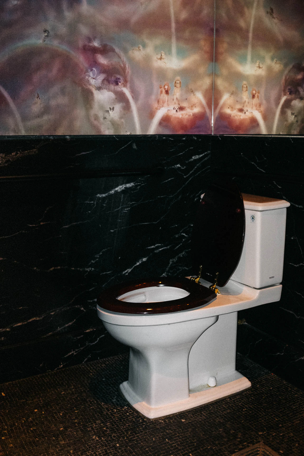 Toilet in a reflective wallpaper bathroom. Red Sink #03 (Not Pictured) from Jonathan Grado's Hold Down to Flush.