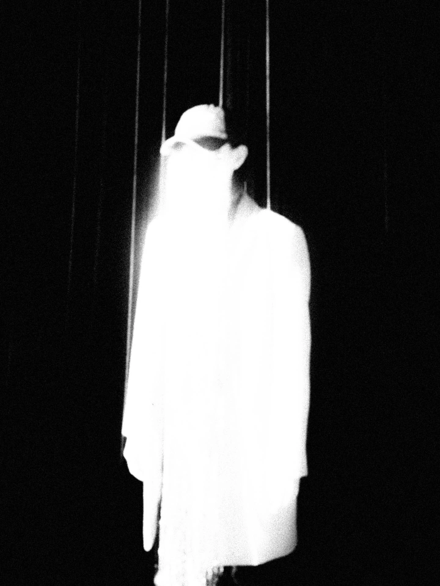White man on black background
