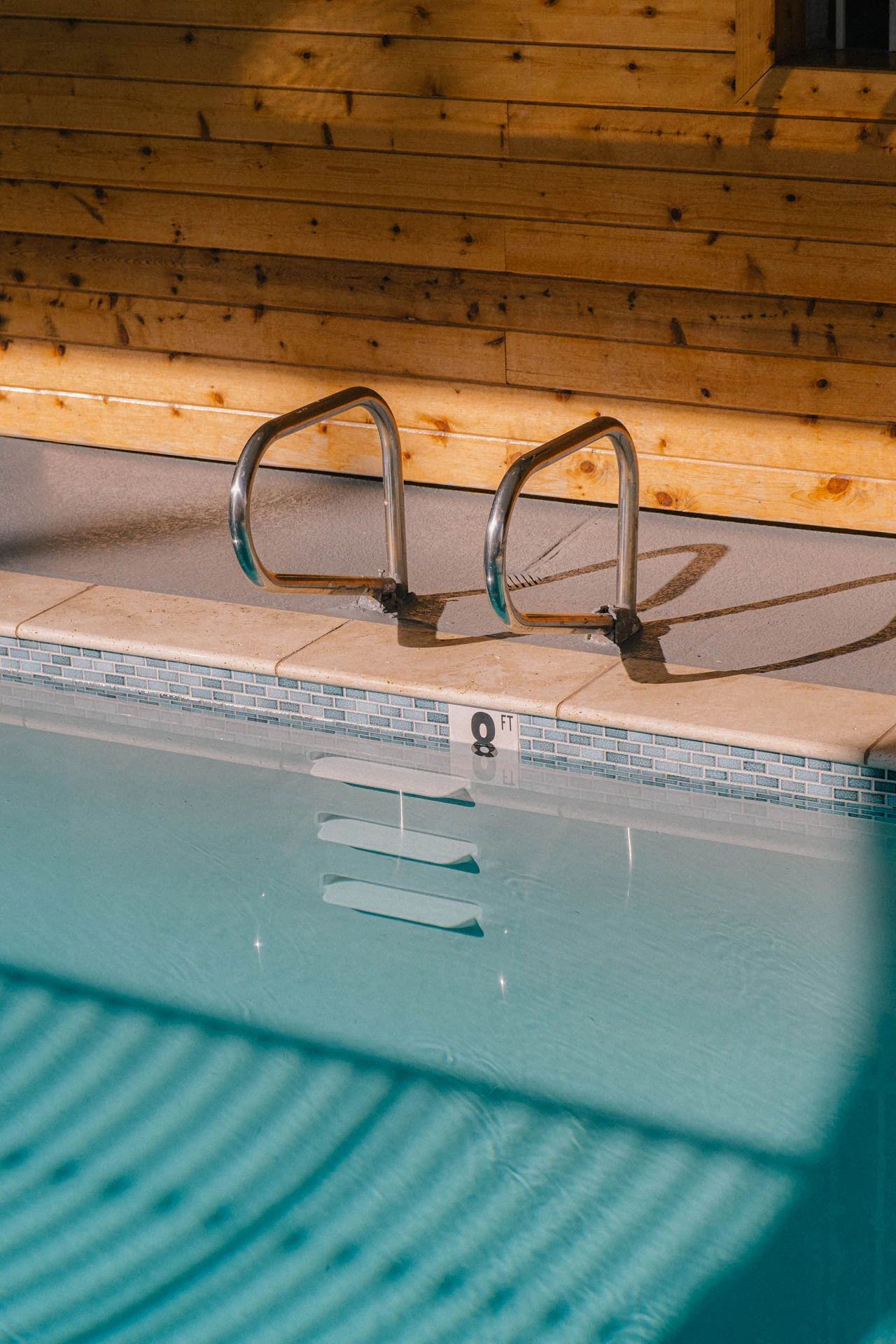 ladder of a swimming pool at sunrise in Los Angeles California