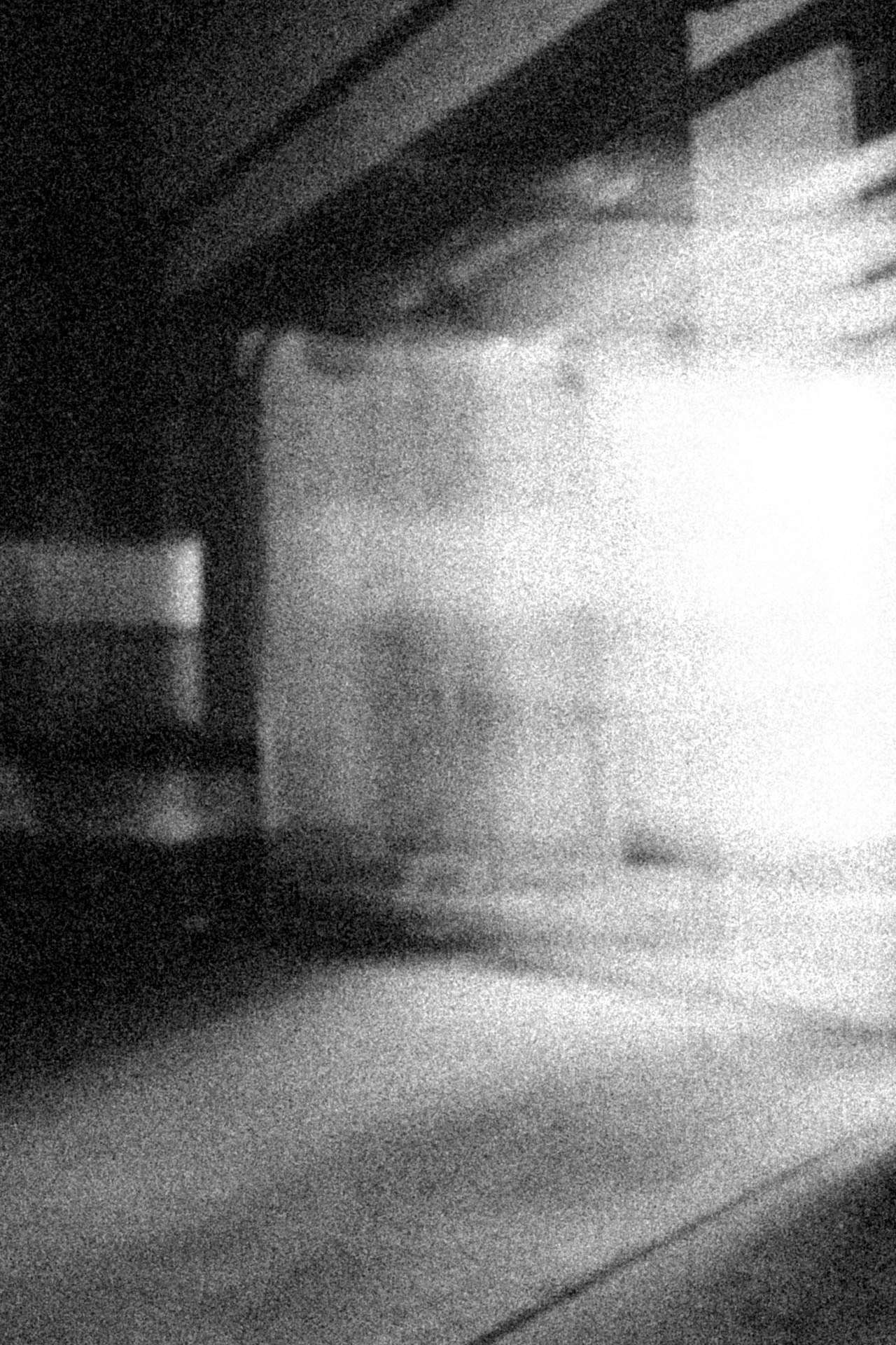 Long exposure of a garage light at night. Neighbors from Jonathan Grado's Dirty Static.