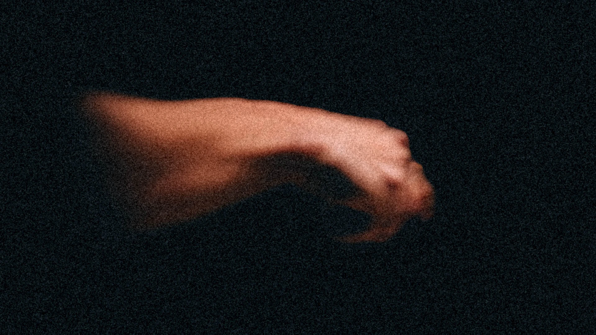 A hand coming out of shadows holding something unseen. Reaching Out from Jonathan Grado's Dirty Static.