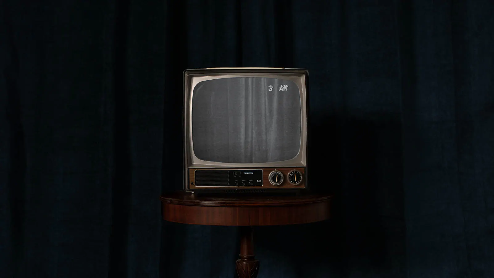 old retro CRT tv showing channel 3am in front of blue velvet. for Jonathan Grado Overthinking